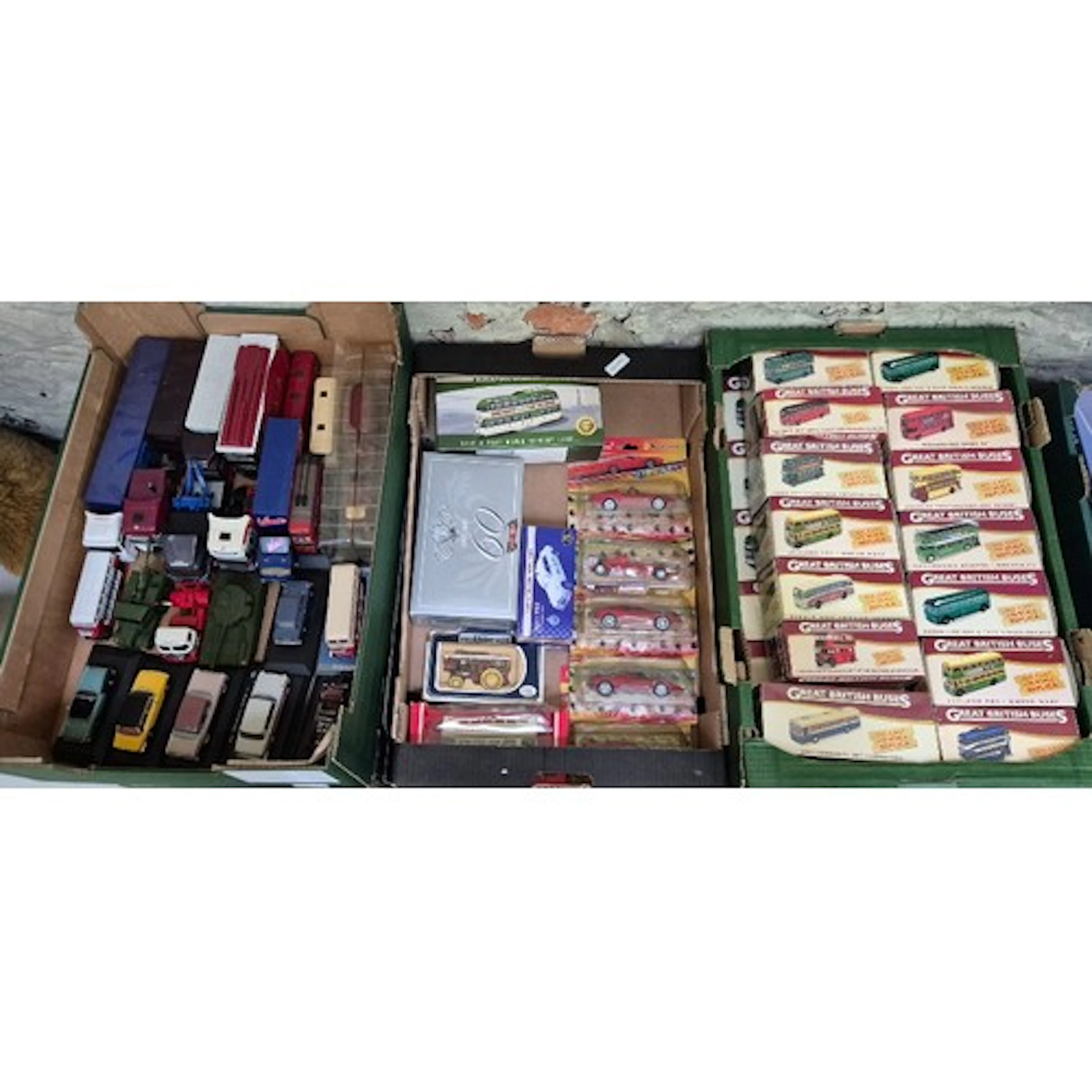 Three boxes of assorted diecast model vehicles to include Di...