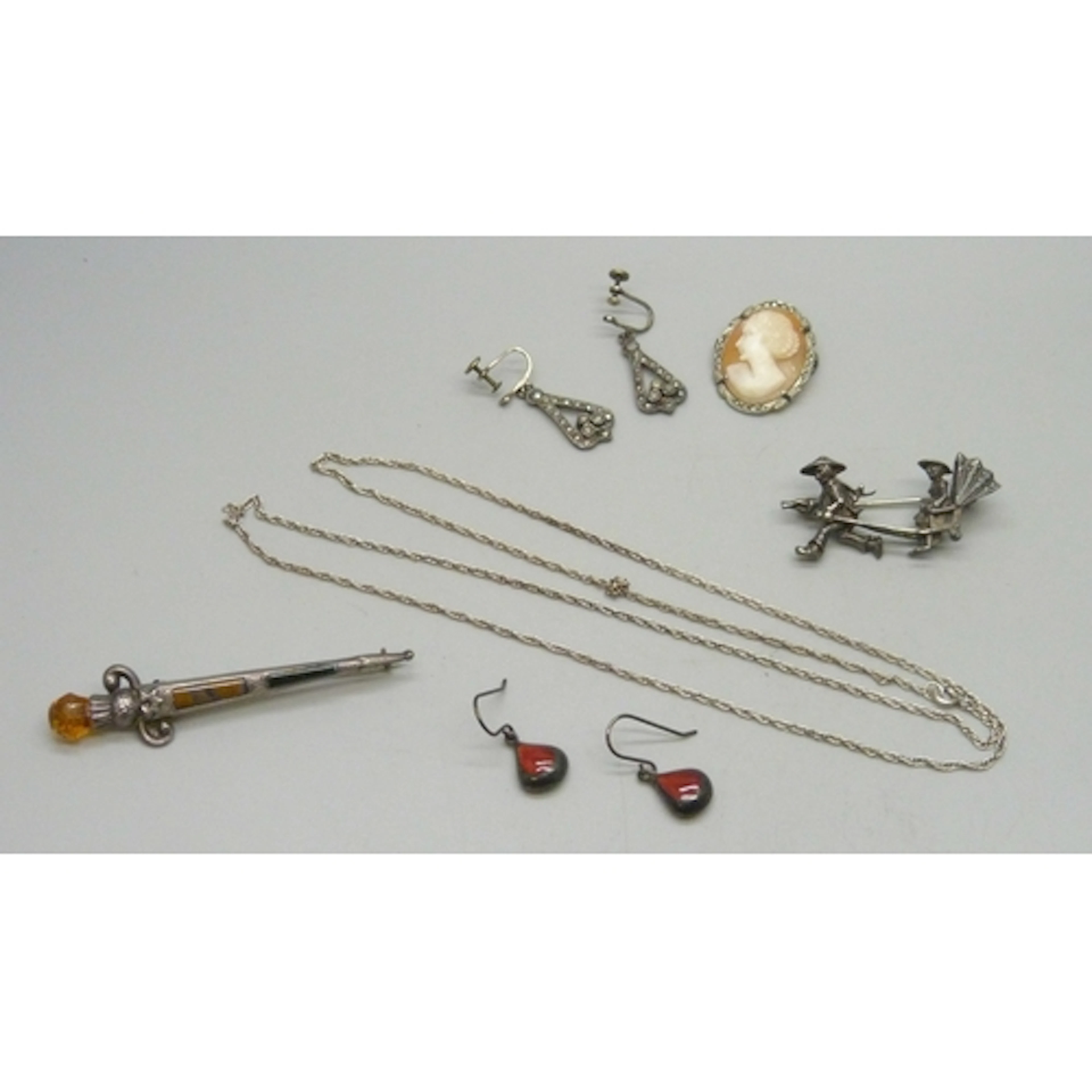 A collection of silver and white metal jewellery including a...