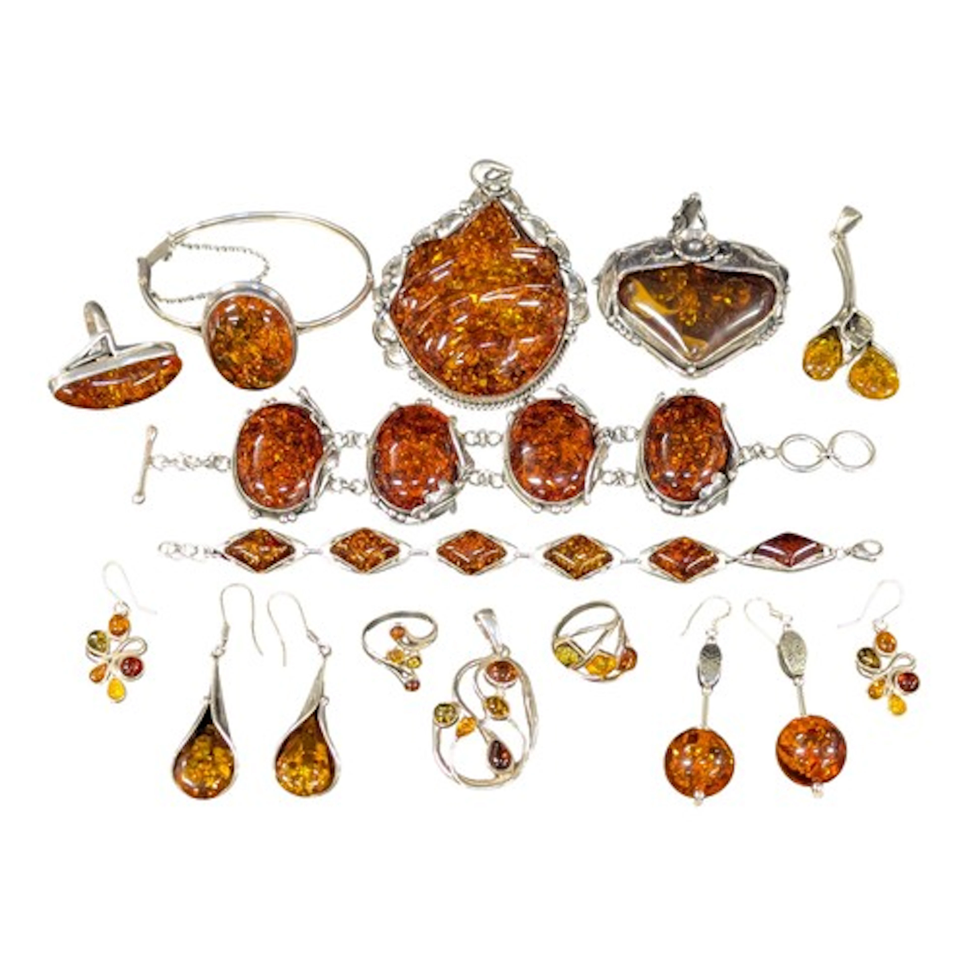 A silver and amber coloured resin four panel cabochon bracel...