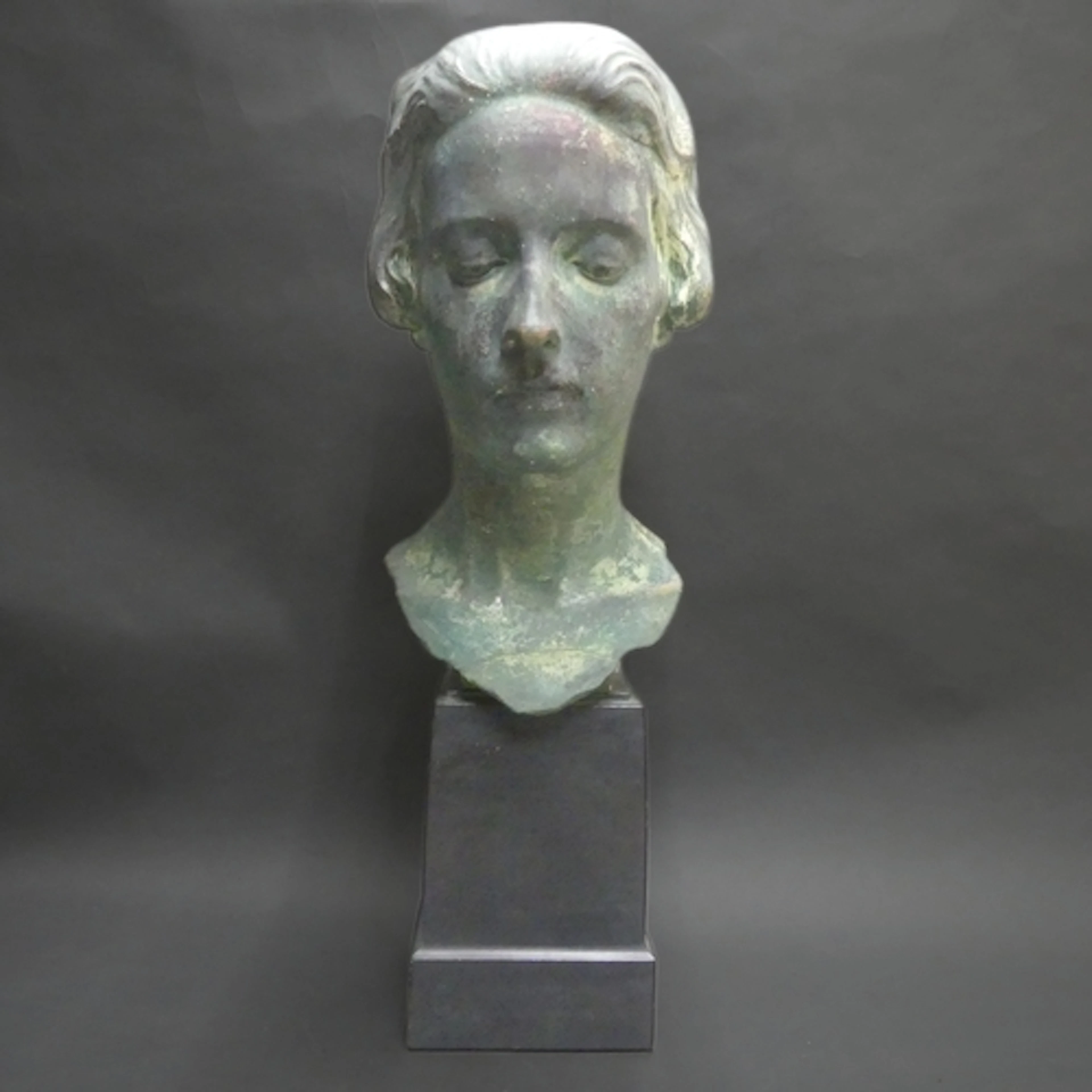 Cecil Gunthorp - A verdigris bronzed plaster sculpture on st...