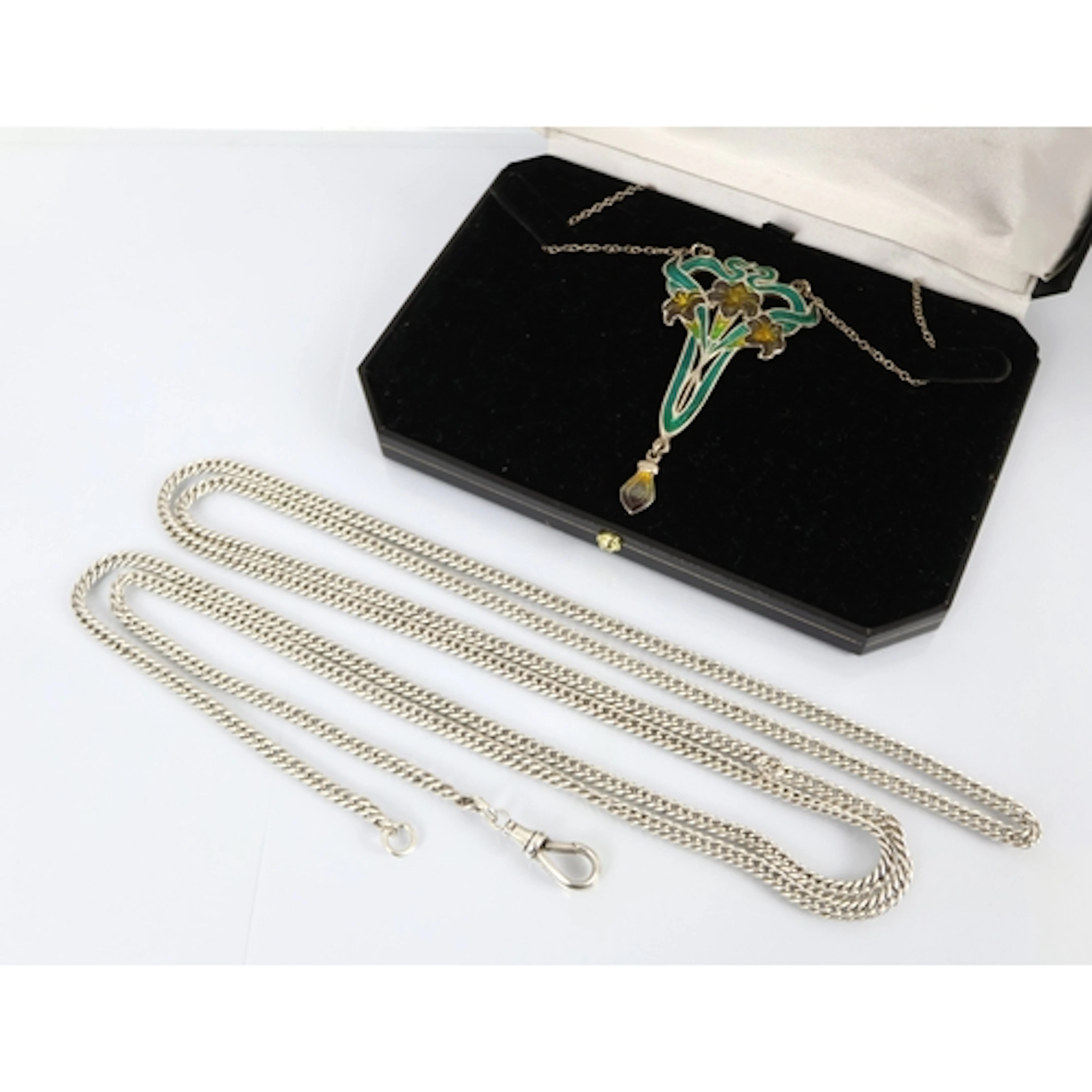 A silver long guard chain of uniform curb link and with swiv...