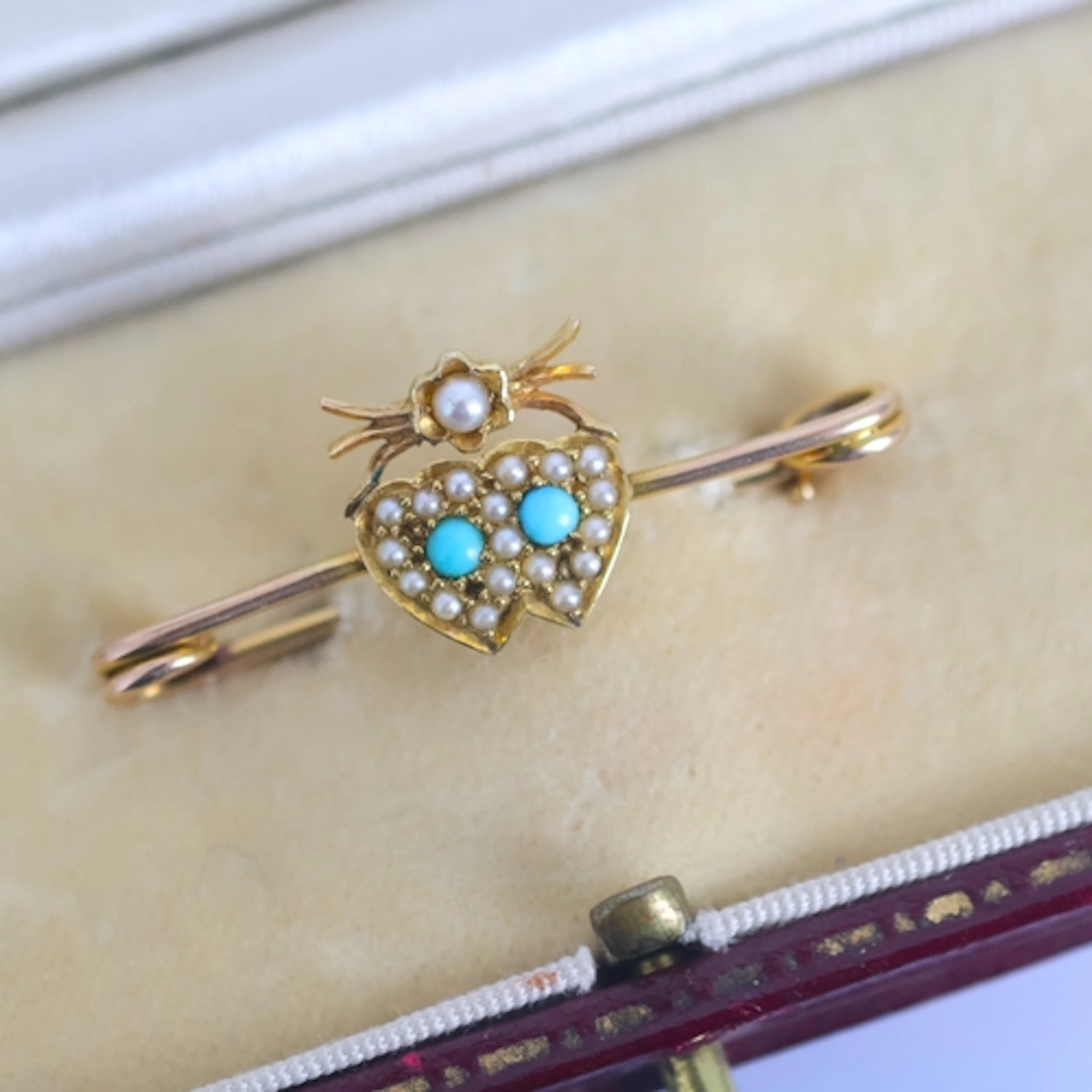 A late 19th century seed pearl and turquoise brooch, the dou...