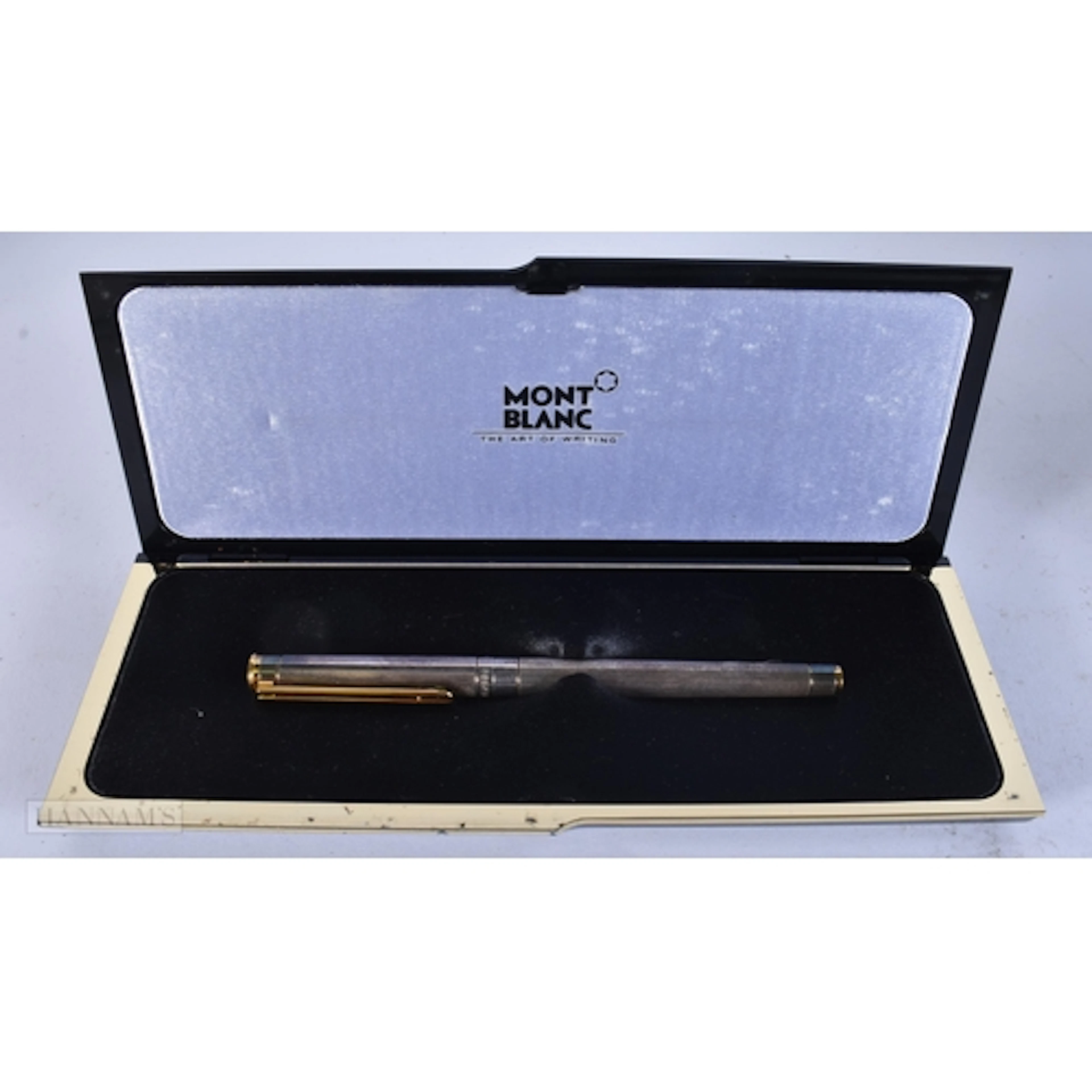 A SILVER MONTBLANC PEN. 13.5 cm long.