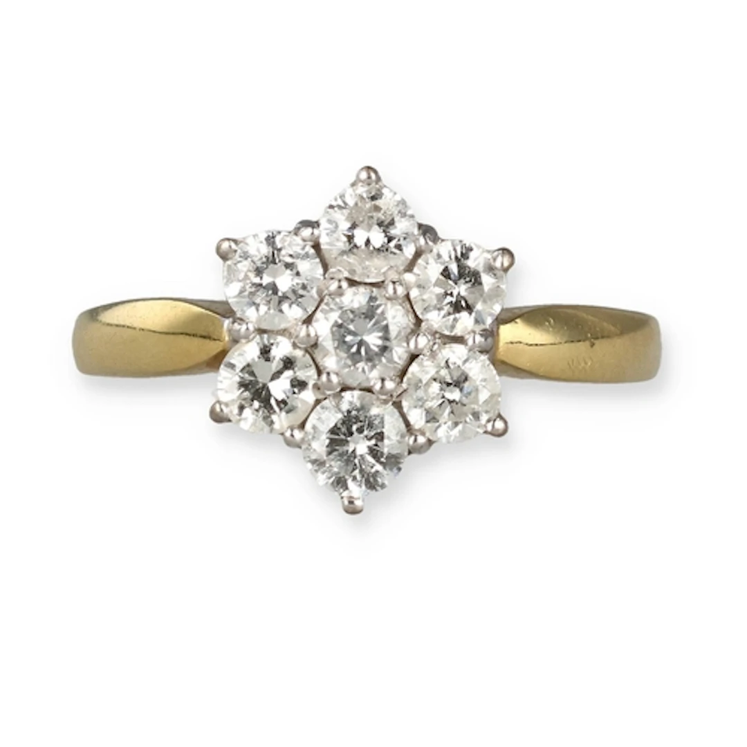 AN 18 CARAT GOLD DIAMOND FLORAL CLUSTER RING Weight: 4.6gms ...