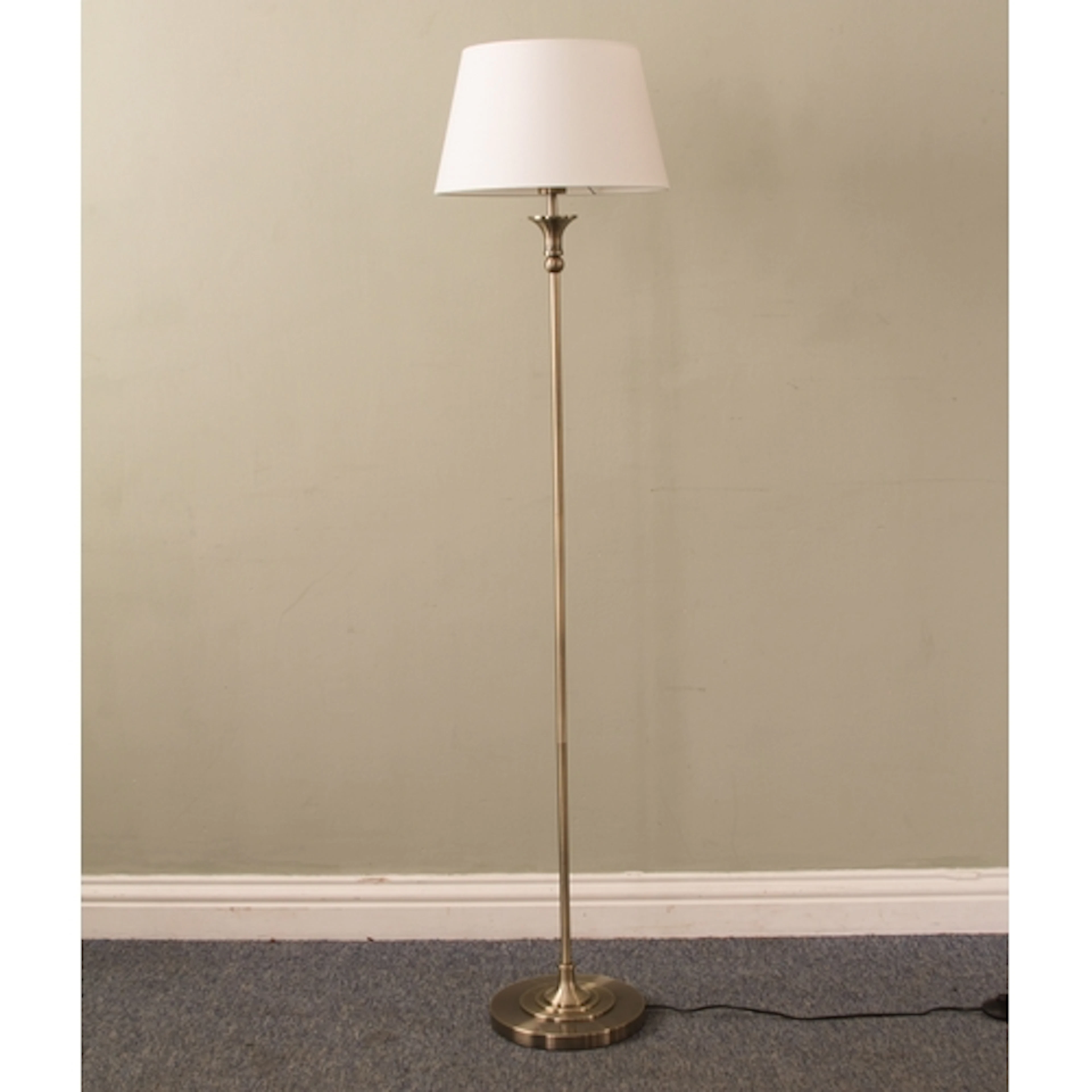 A modern brushed antiqued brass toned standard lamp - with c...