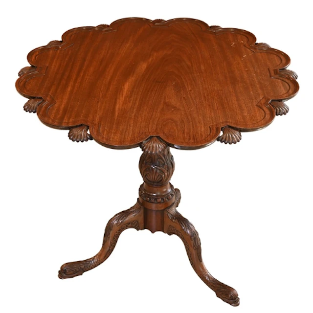 A mahogany tripod table, 20th c, the scalloped top with scal...