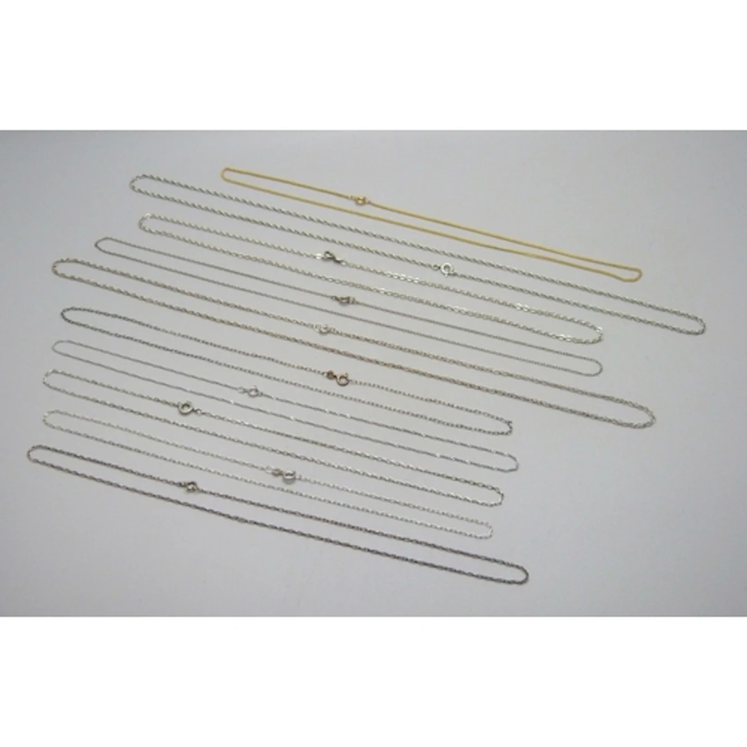 A collection of ten silver and white metal necklace chains, ...