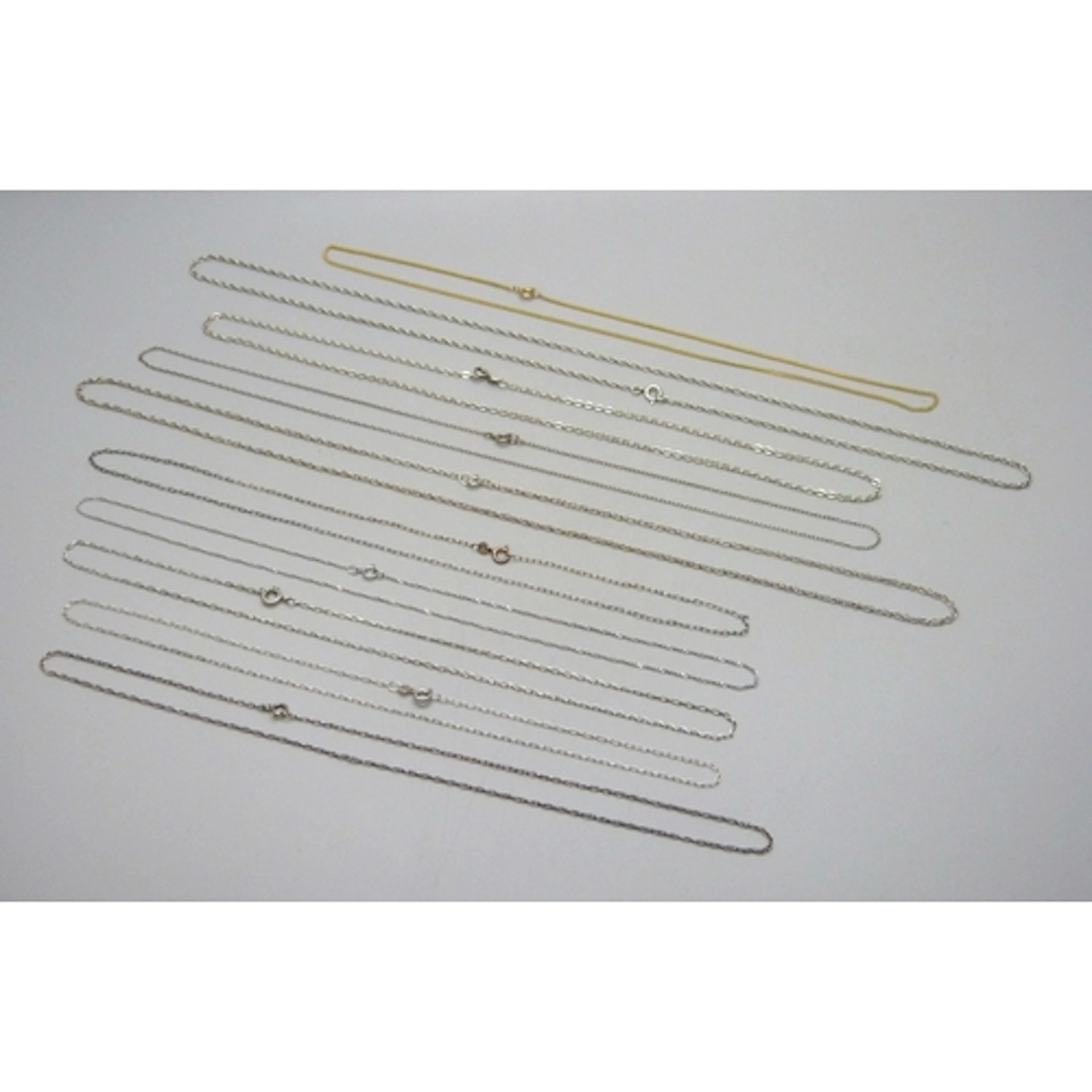 A collection of ten silver and white metal necklace chains, ...