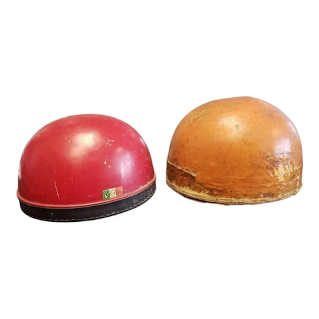 Two mid century Italian and Belgian motor crash helmets. Com...