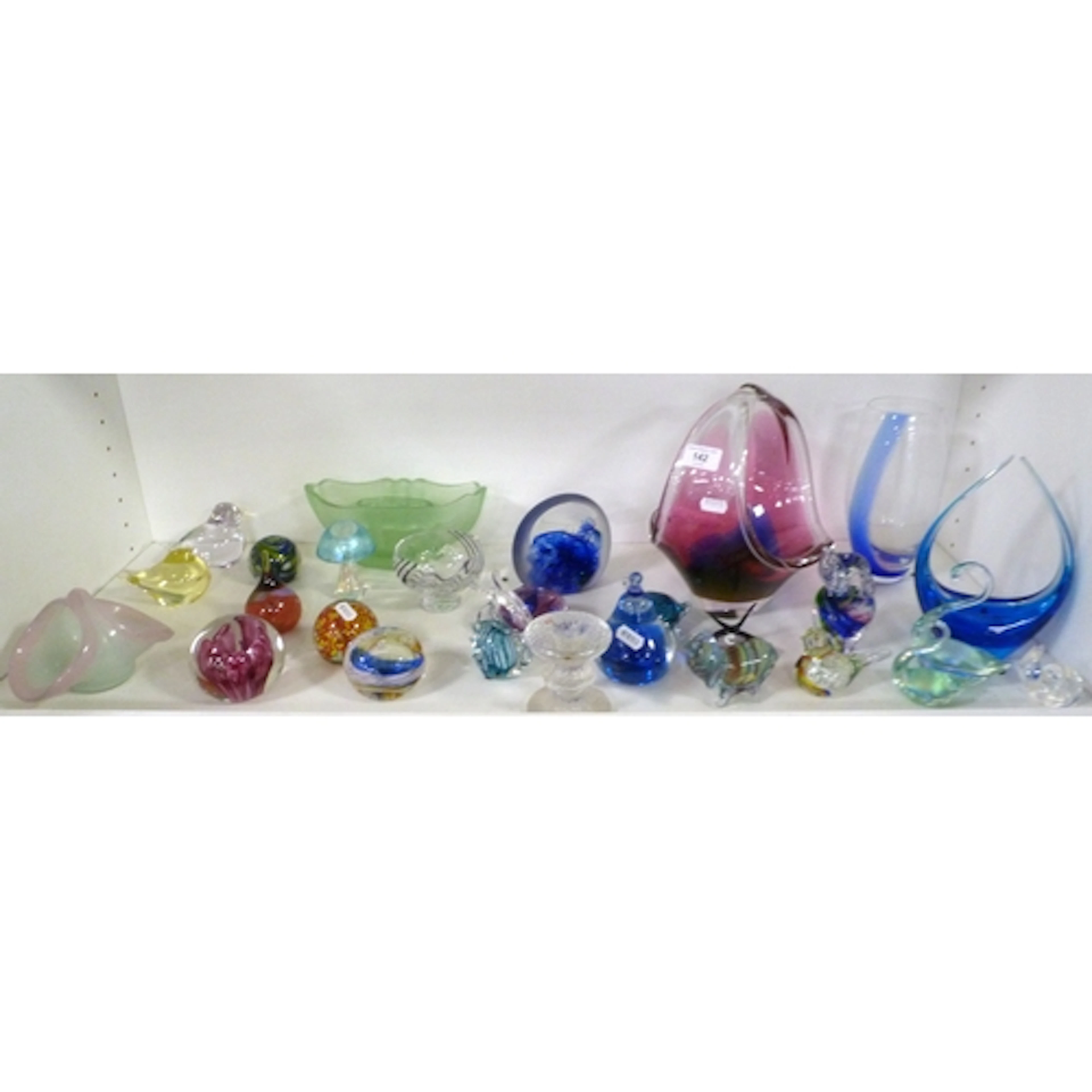 Shelf of art glass to include Selkirk glass paperweight, vas...