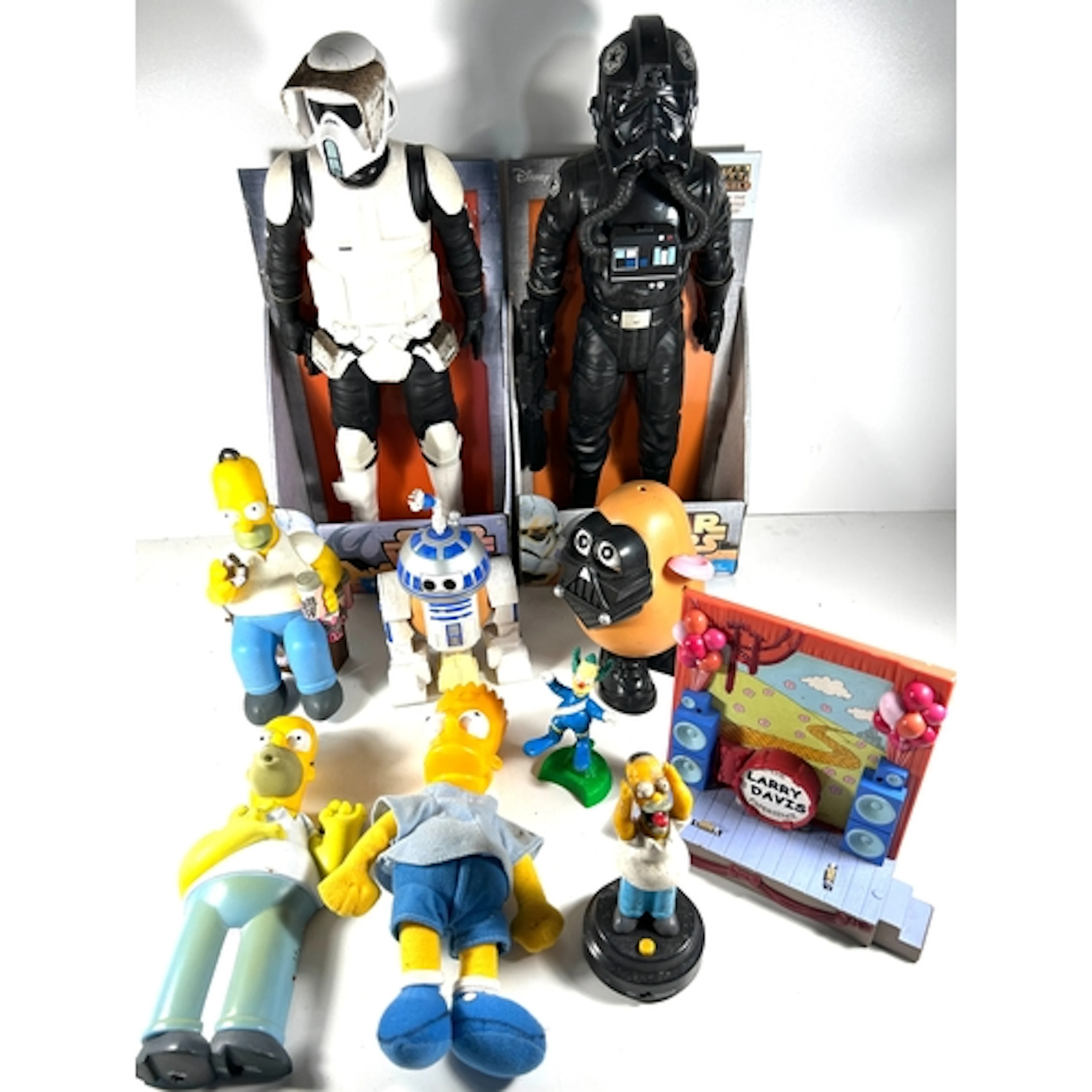 A collection of mixed toys including, Simsons, star wars, PE...