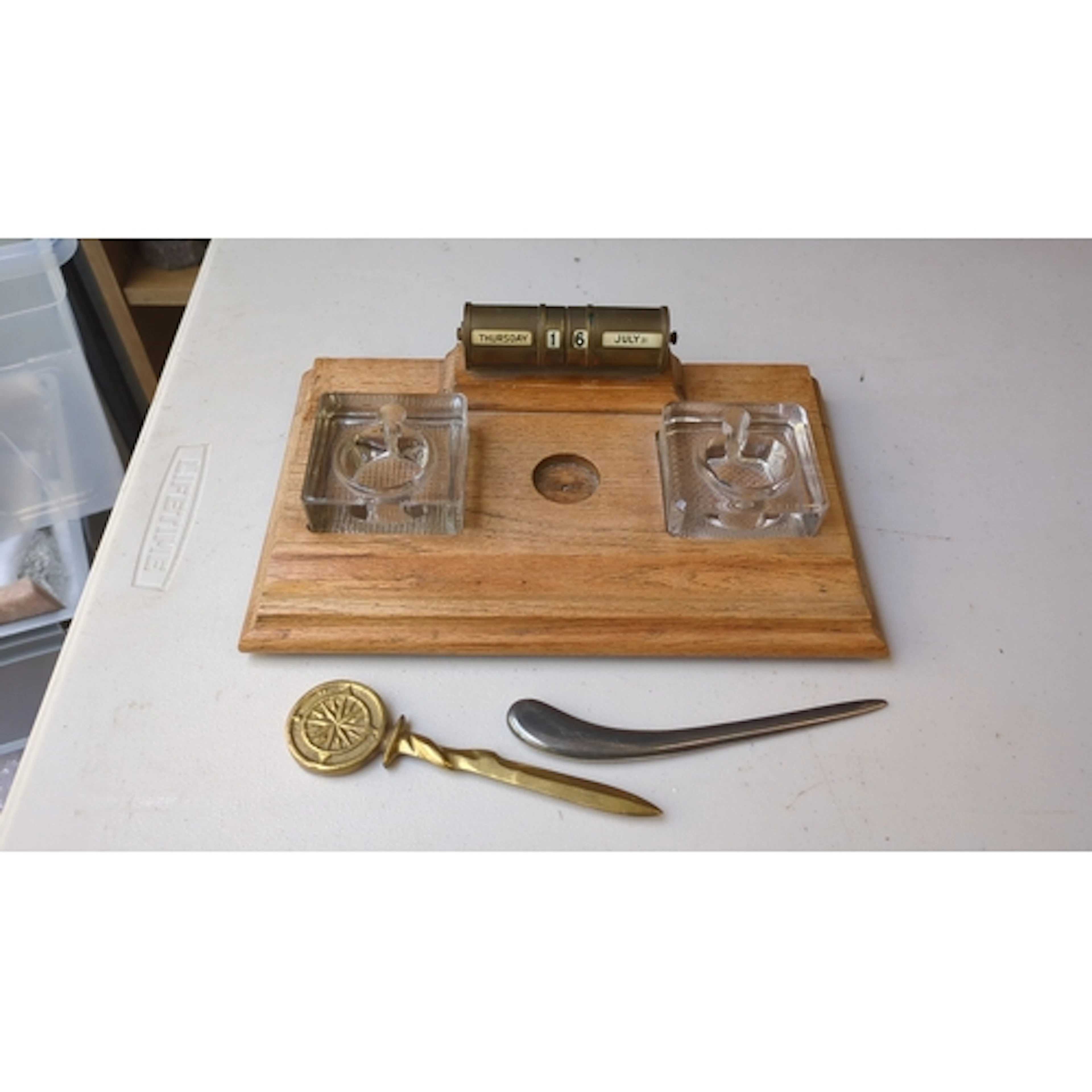 Desk set comprising an oak stand fitted with a brass perpetu...