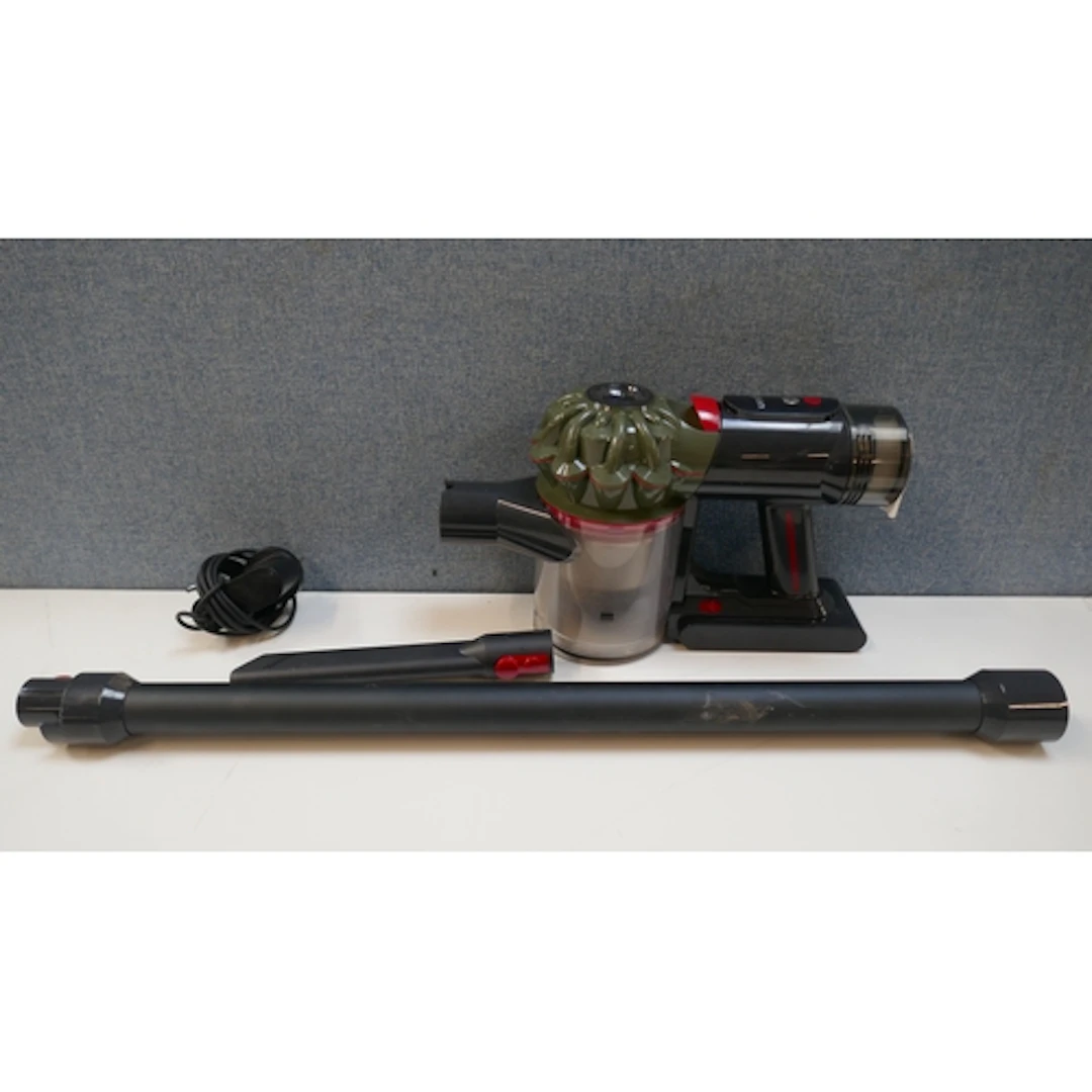 A Dyson V8 Cyclone stick vacuum cleaner with charger, origin...