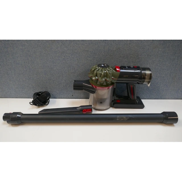 A Dyson V8 Cyclone stick vacuum cleaner with charger, origin...