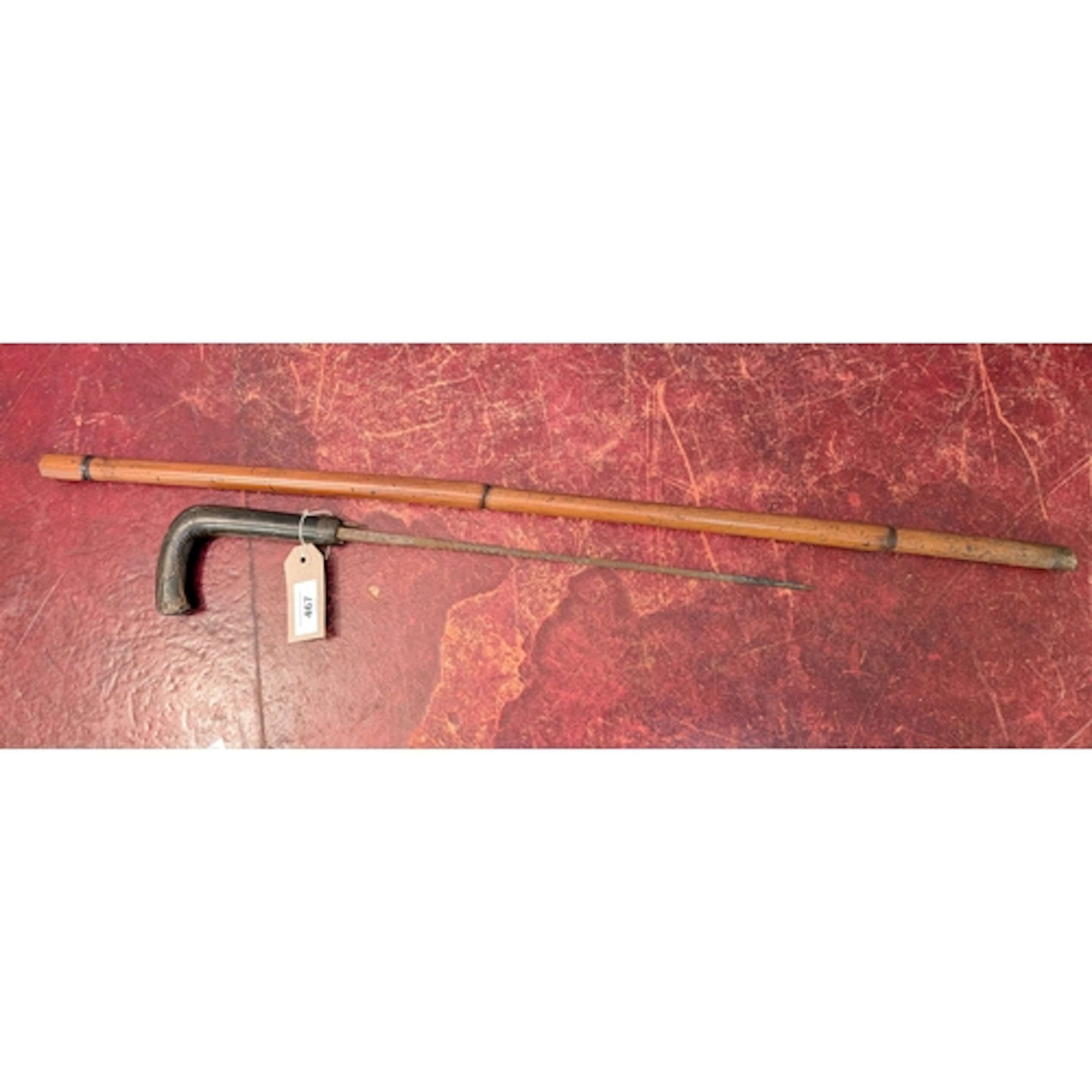 An antique sword stick with club style handle