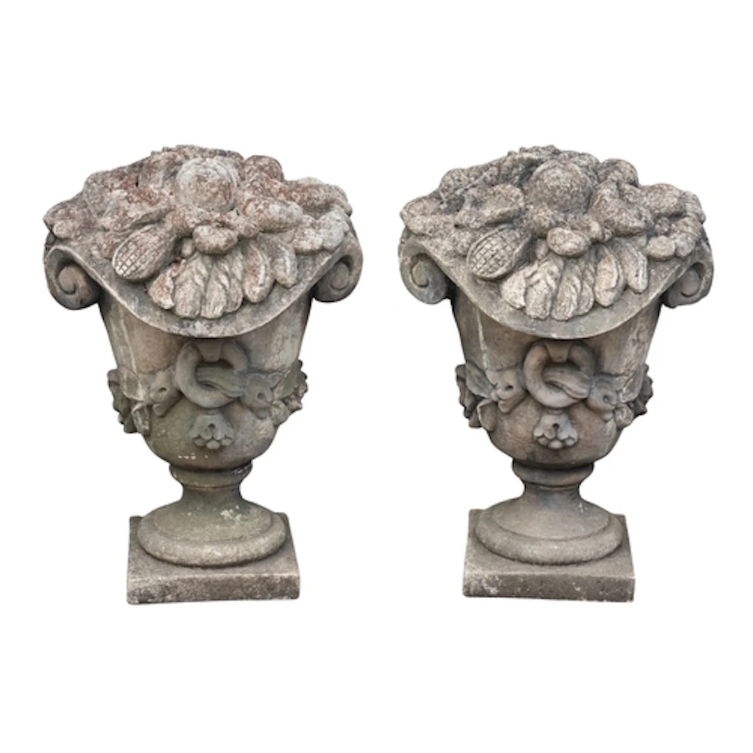 A pair of stone composition garden ornaments or pier finials...