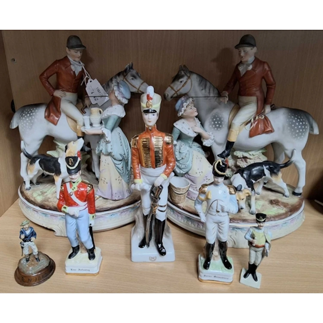 A GROUP OF FIGURES, comprising a pair of figure groups, depi...