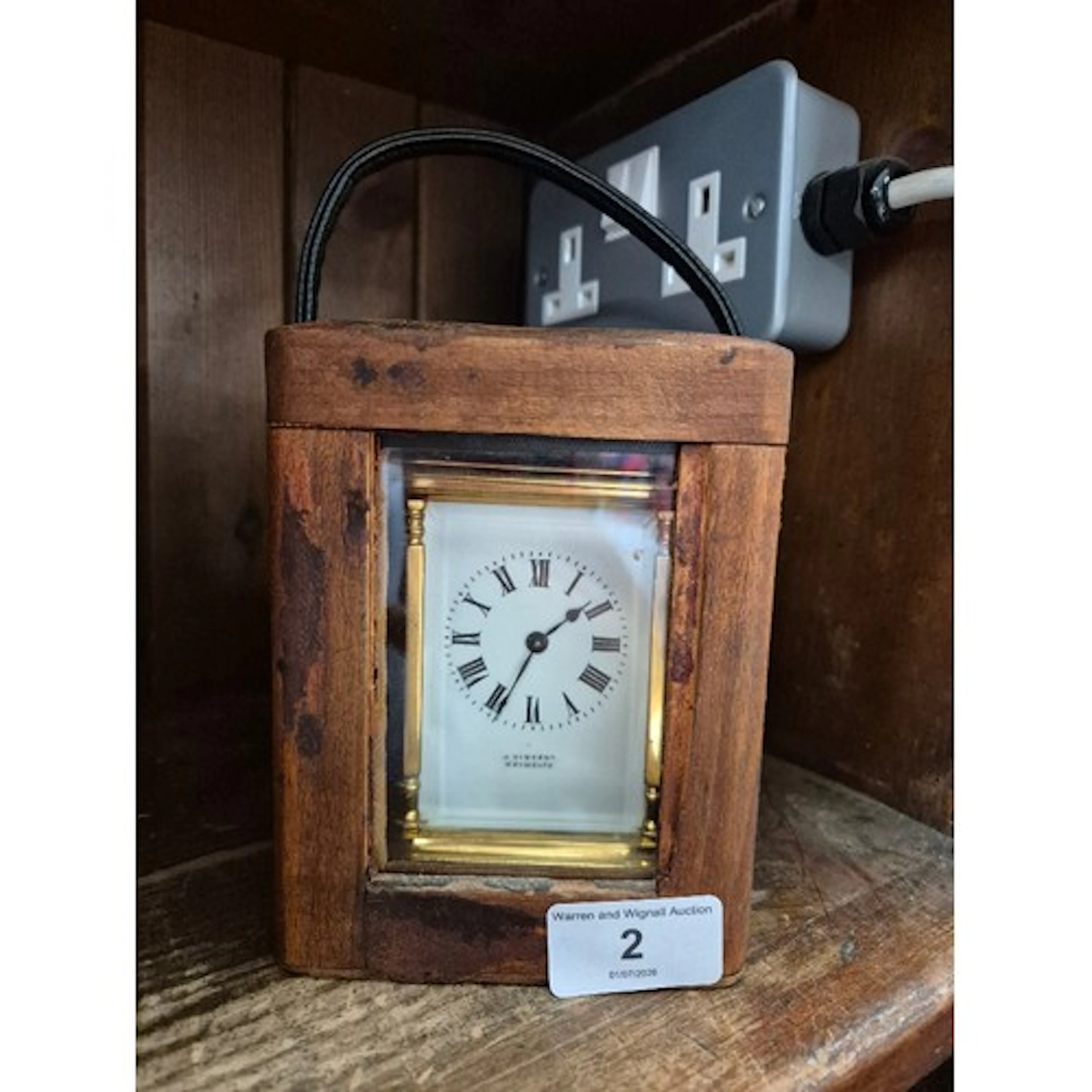A carriage clock by J Vincent, Weymouth, bearing a Harrods s...