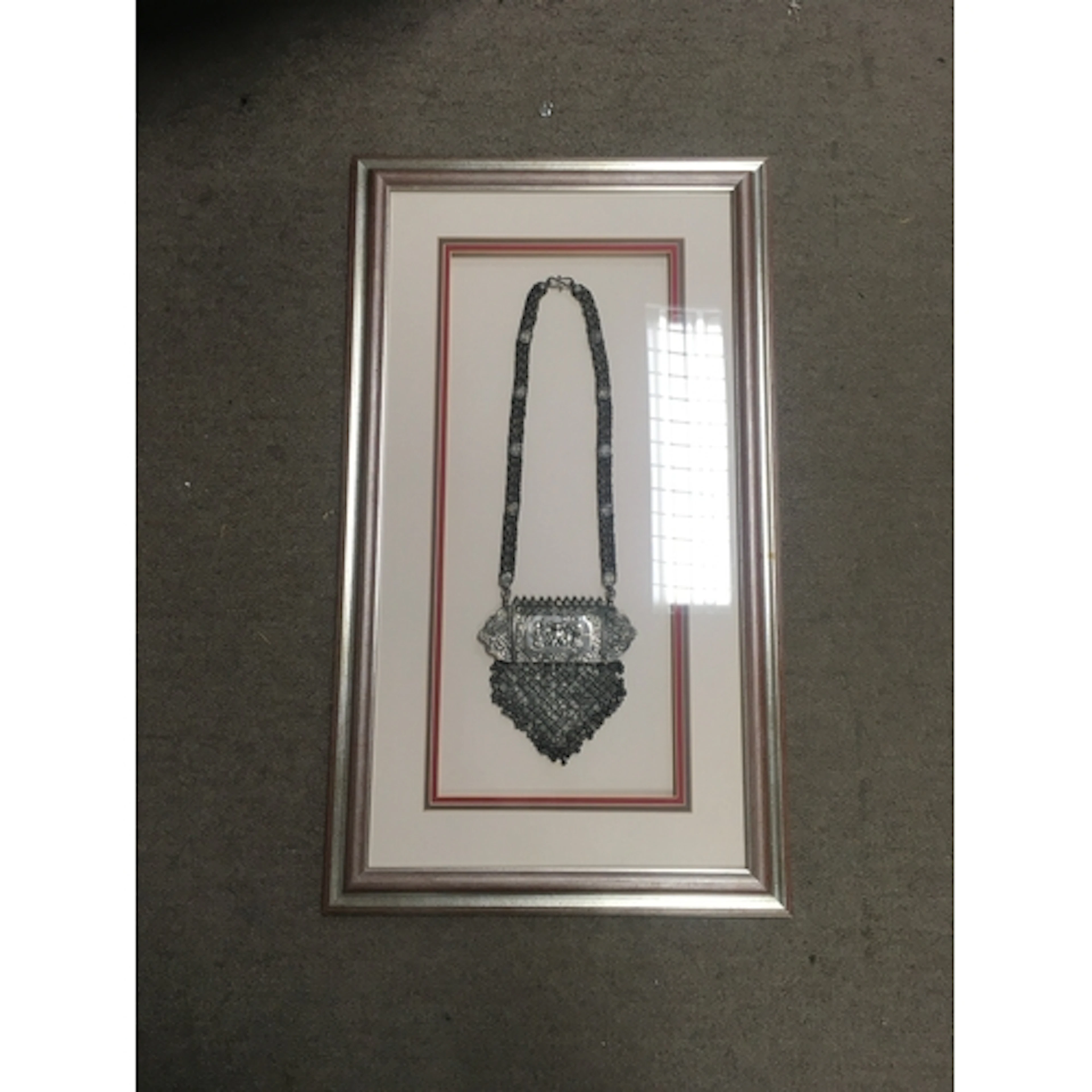 Framed silver eastern jewellery