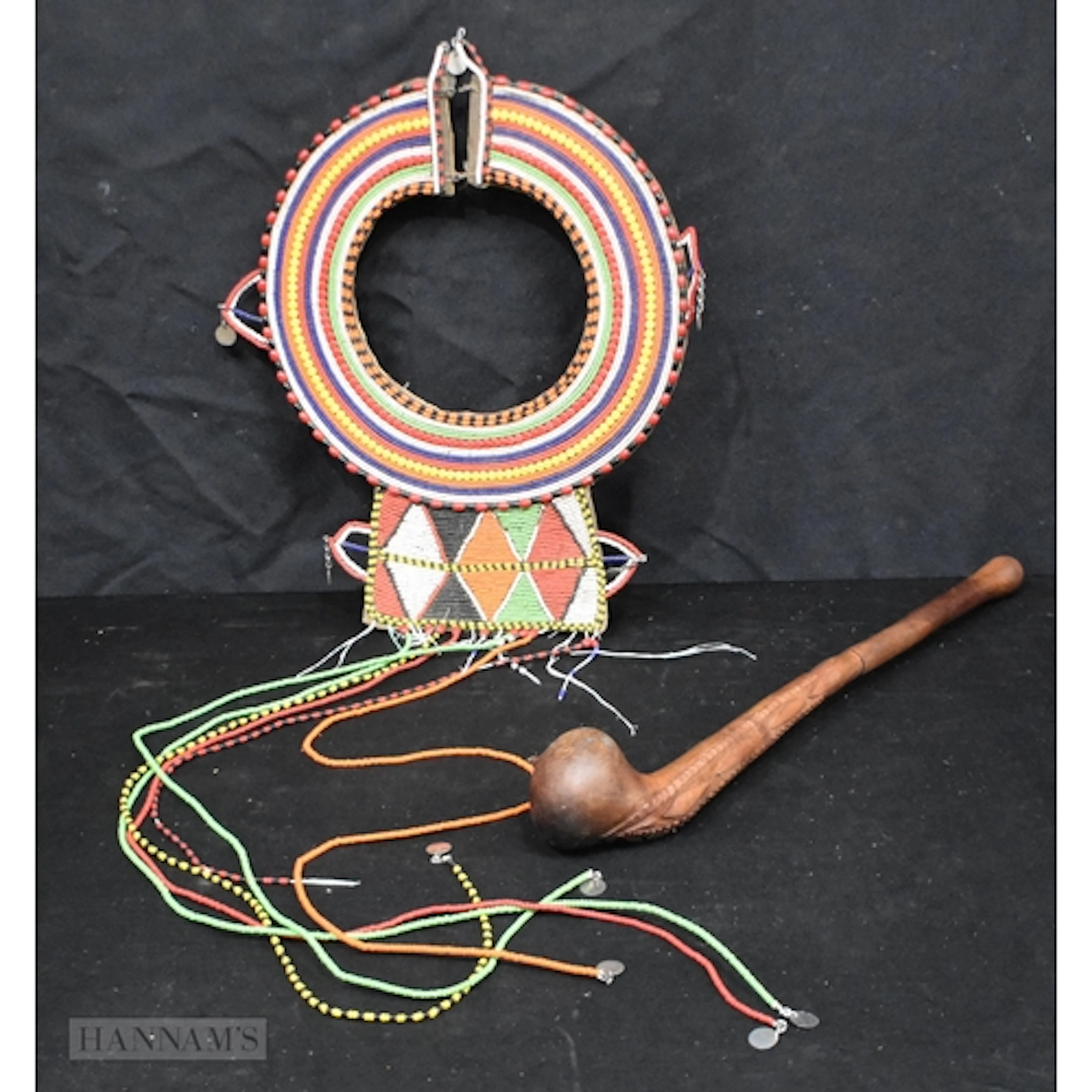 An African Tribal carved wood Rungu throwing club together w...