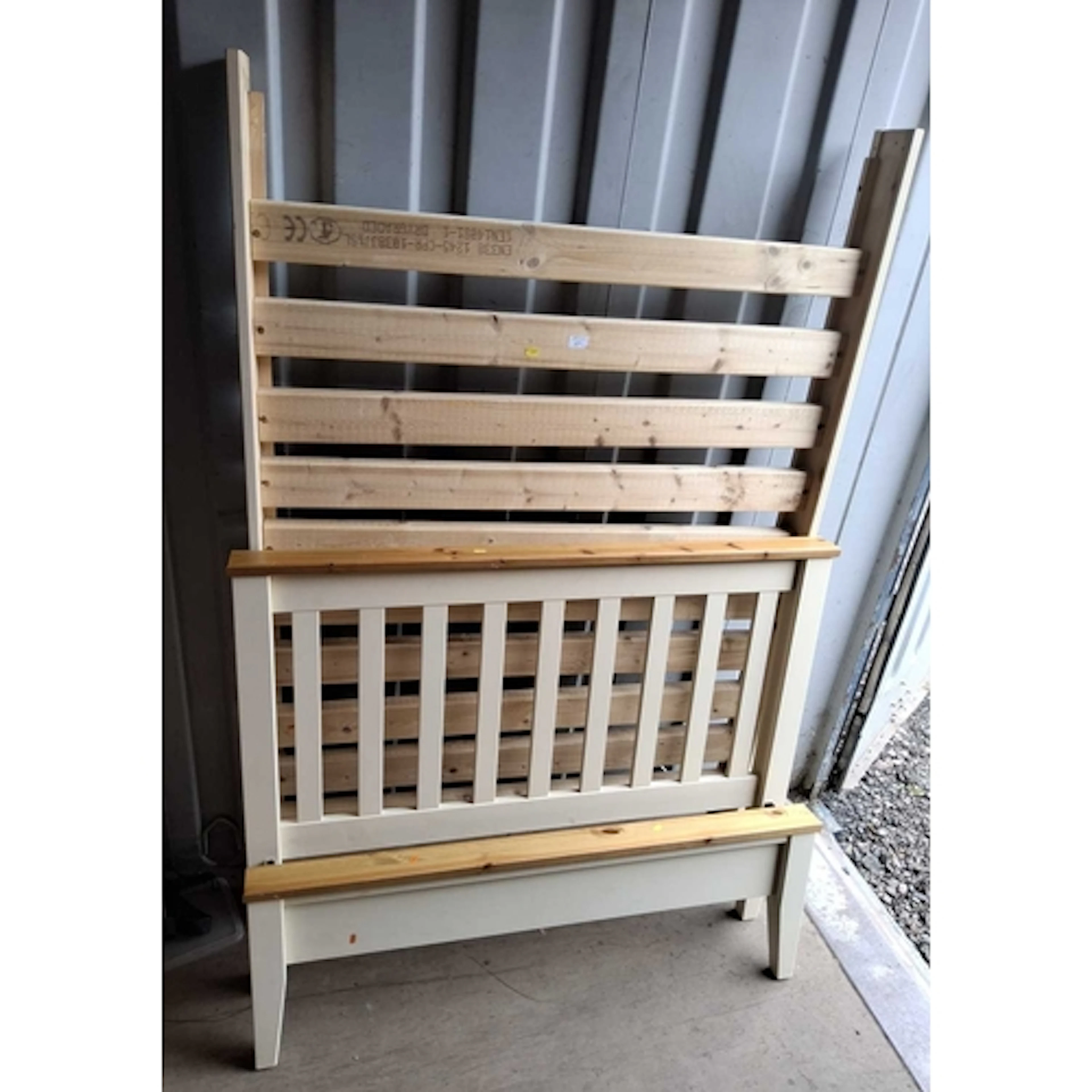 A MODERN PARTIALLY PAINTED PINE 4FT BEDSTEAD marks, scuffs,...