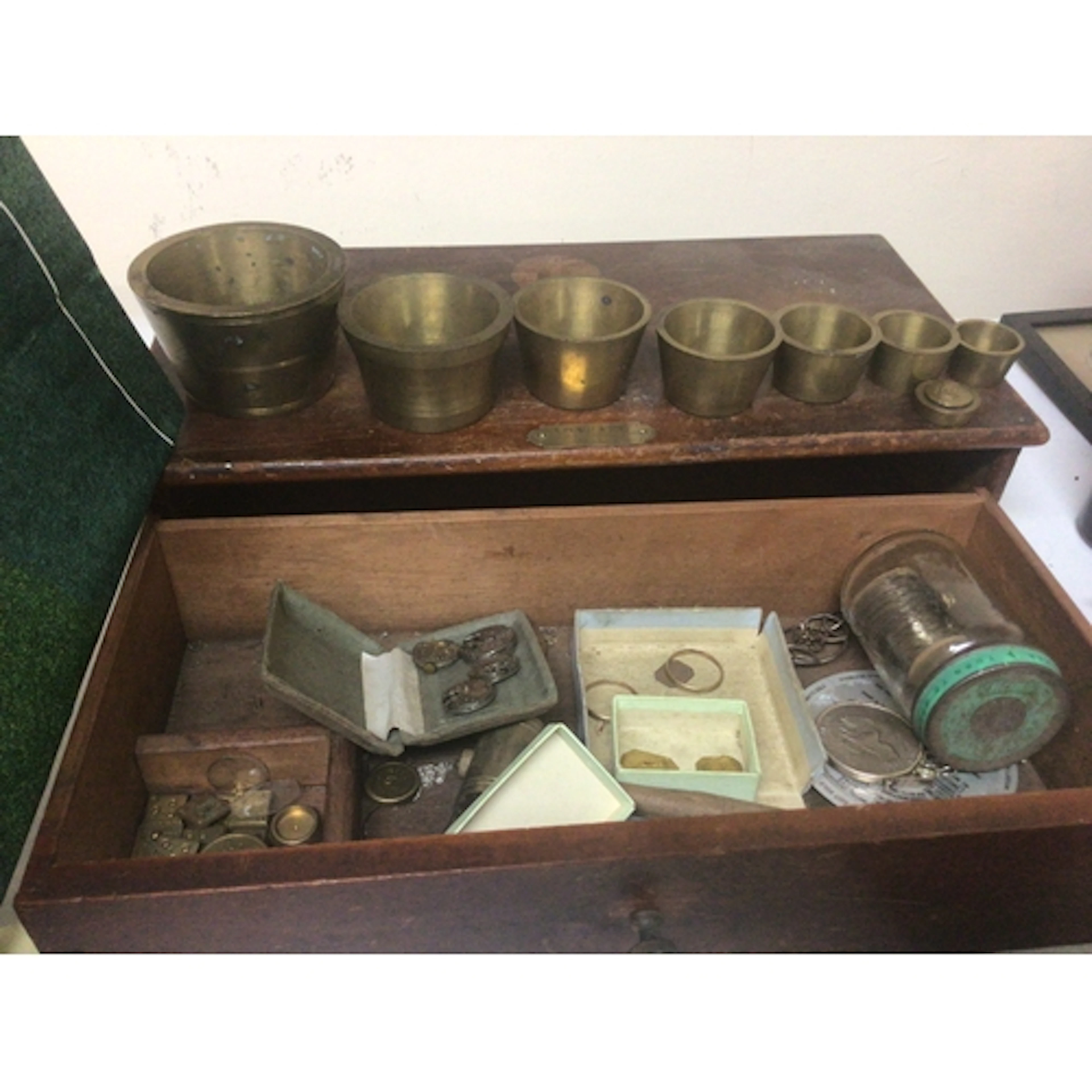 A set of graduating Troy brass weight vessels smaller weight...