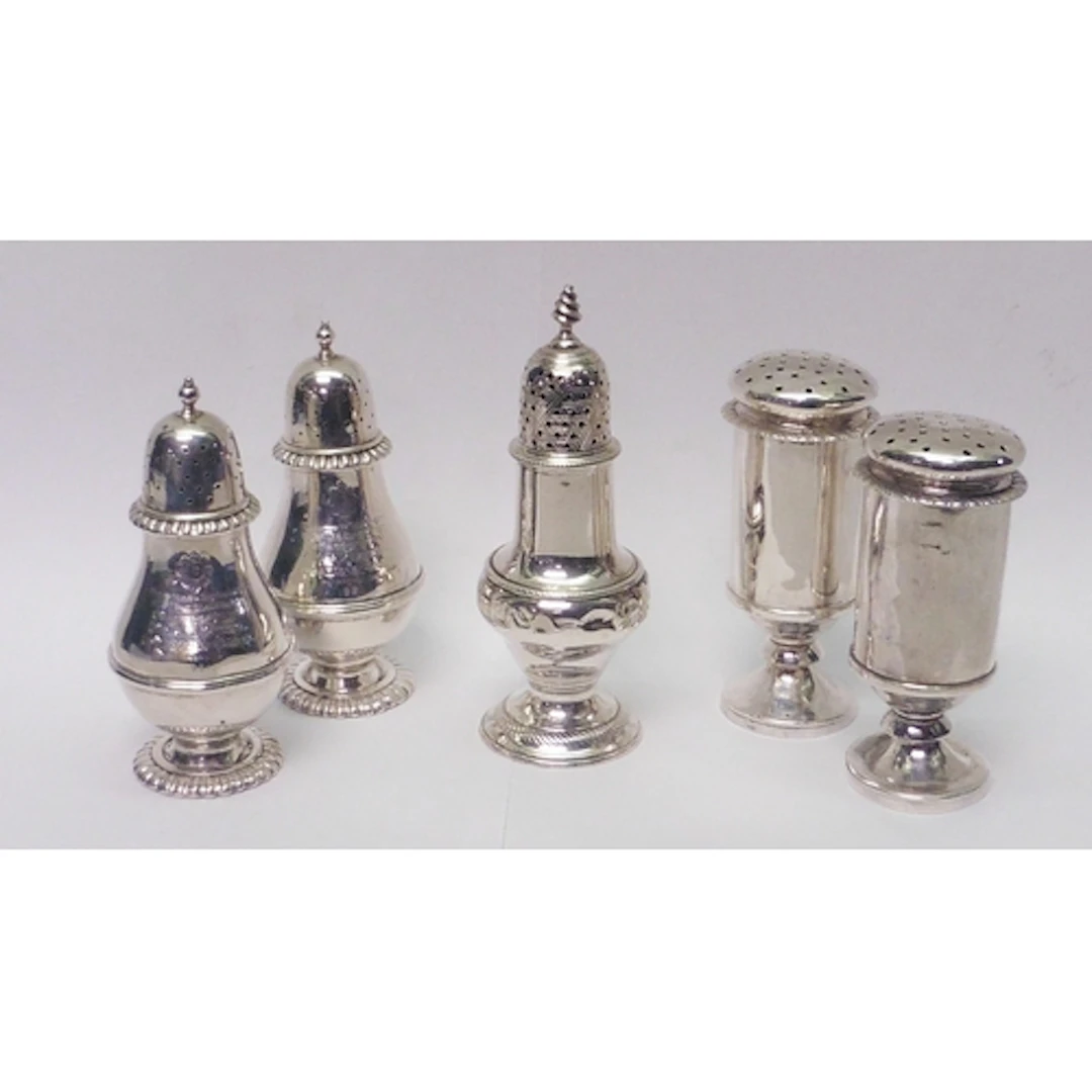 A pair of pounce pots, unmarked white metal, each 100mm tall...