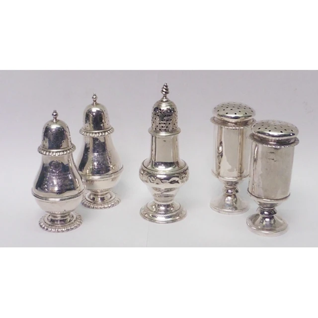 A pair of pounce pots, unmarked white metal, each 100mm tall...
