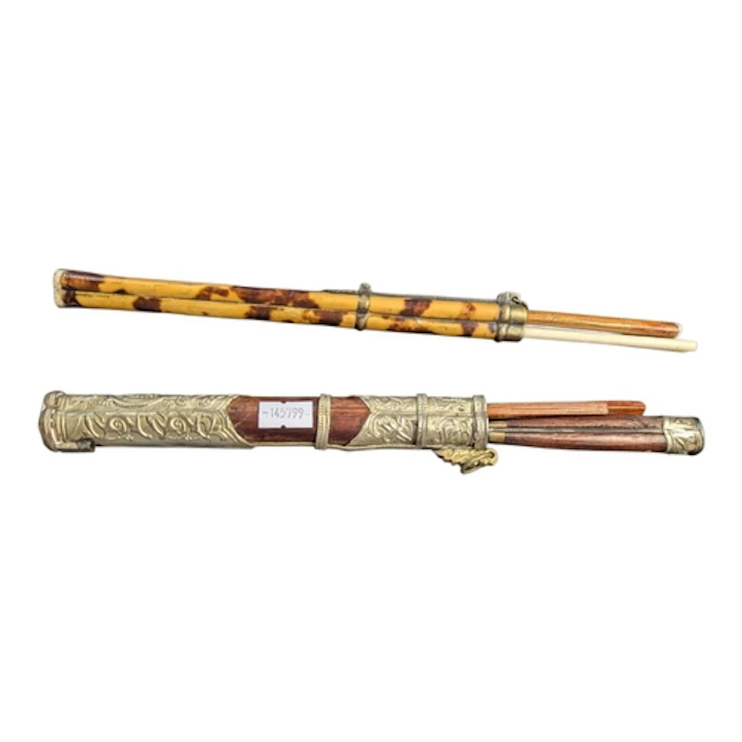 Two sets of 20th century travel cutlery chopsticks. Each wit...