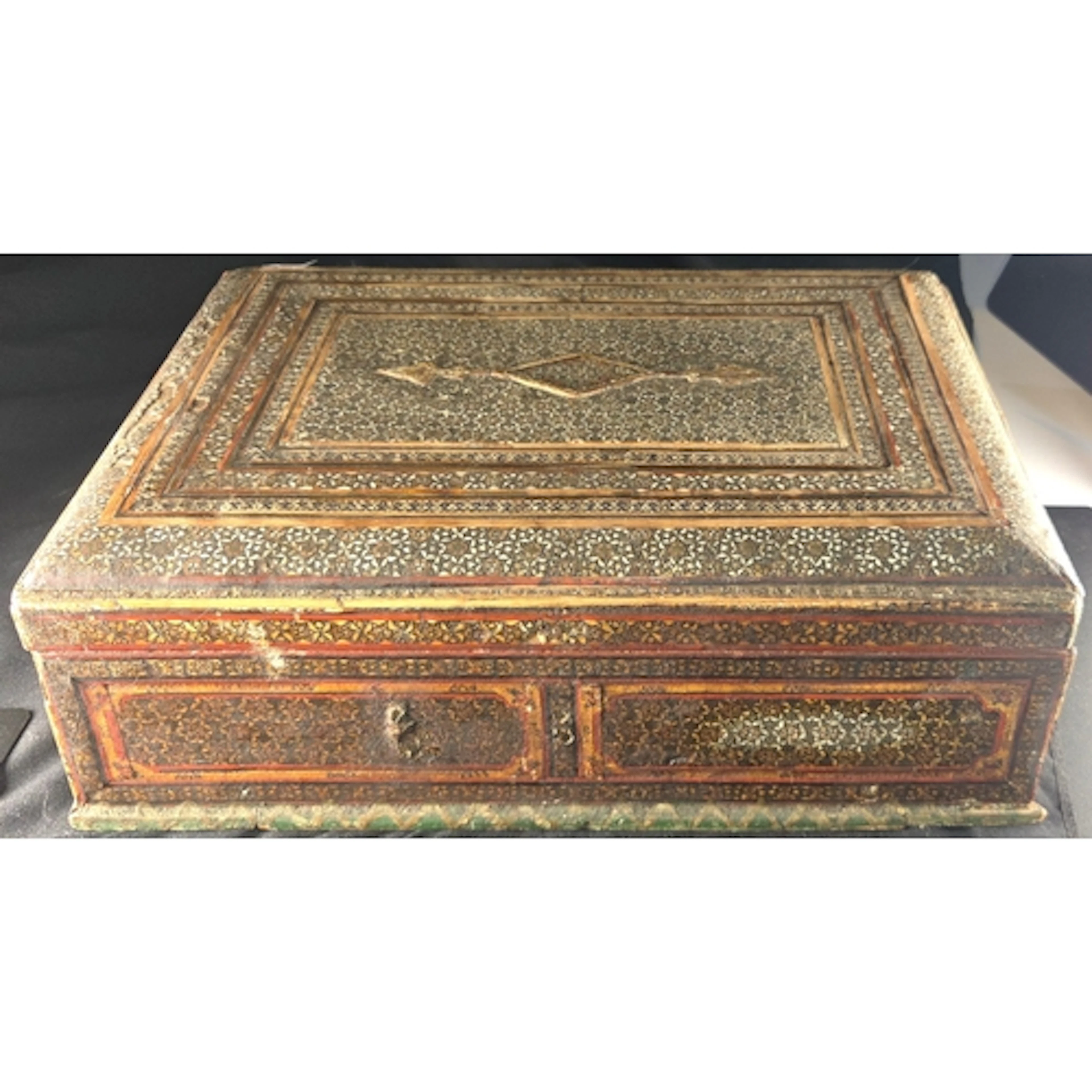 An 18/19th century Persian mirror box with geometric inlay t...