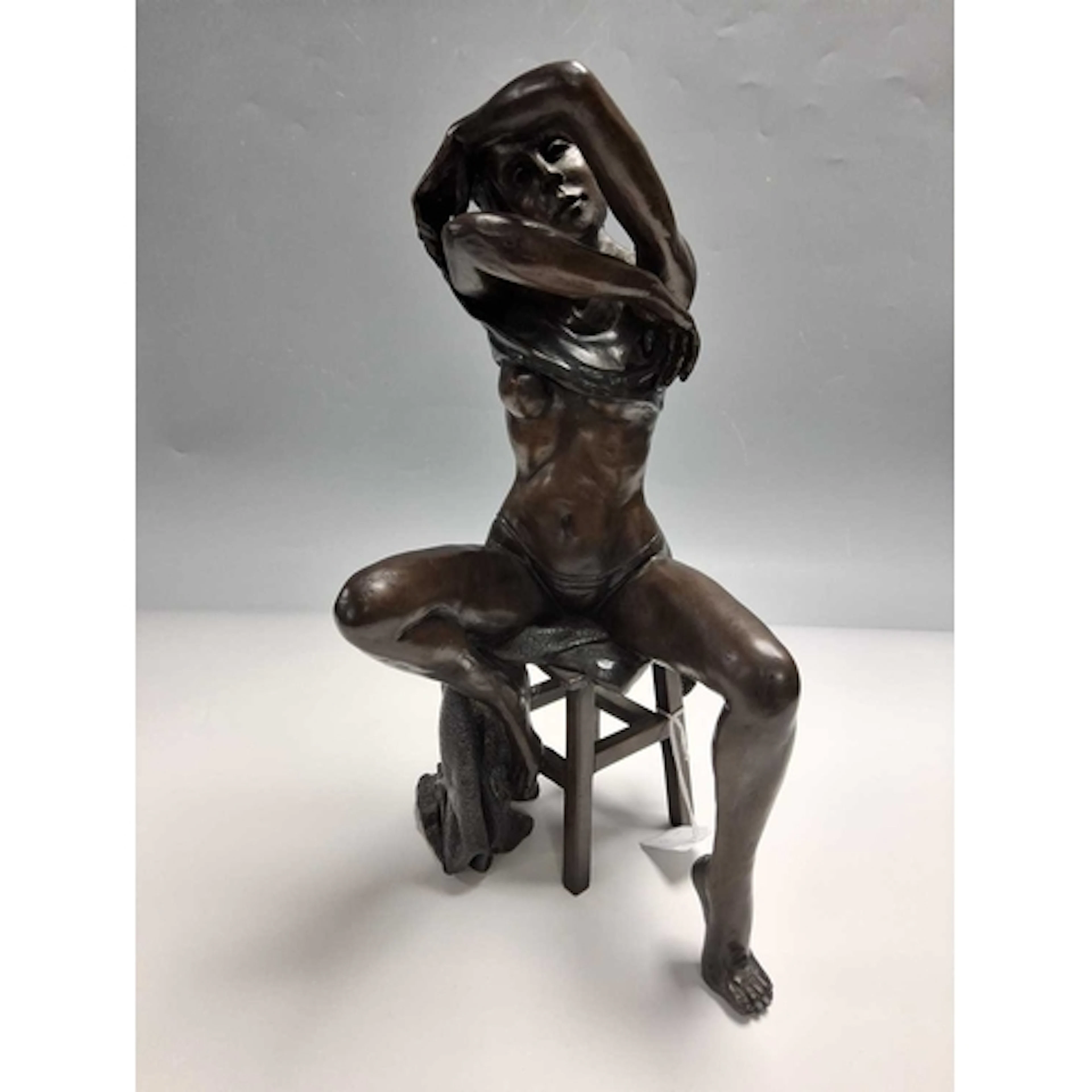 A BENSON LANDES BRONZE FEMALE FIGURE, depicting a female fig...