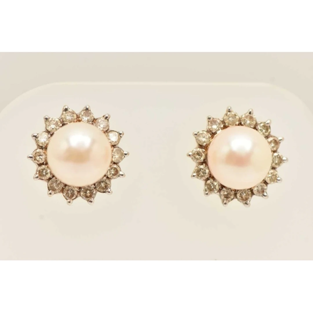 A PAIR OF CULTURED PEARL AND DIAMOND EARRINGS, yellow metal ...