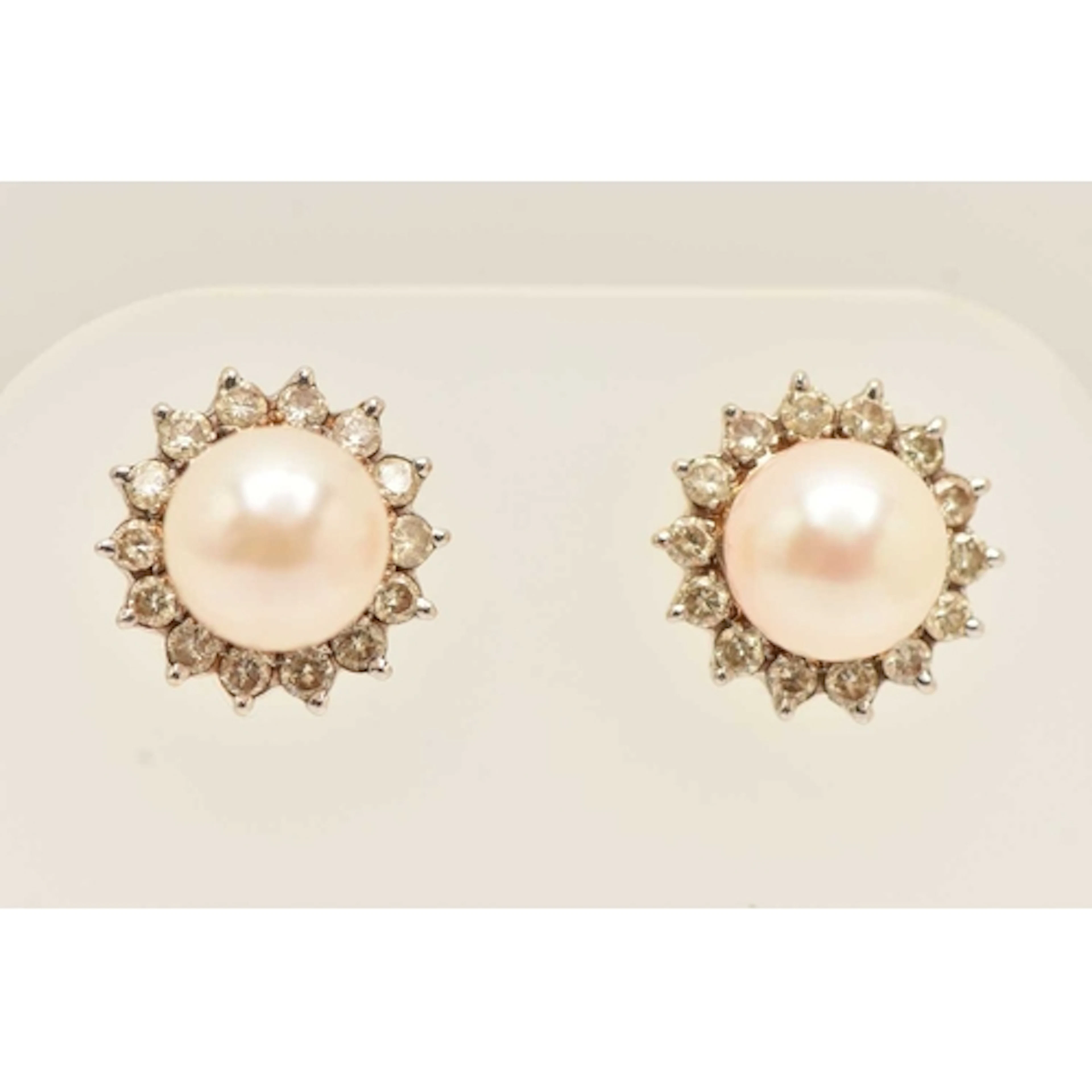 A PAIR OF CULTURED PEARL AND DIAMOND EARRINGS, yellow metal ...