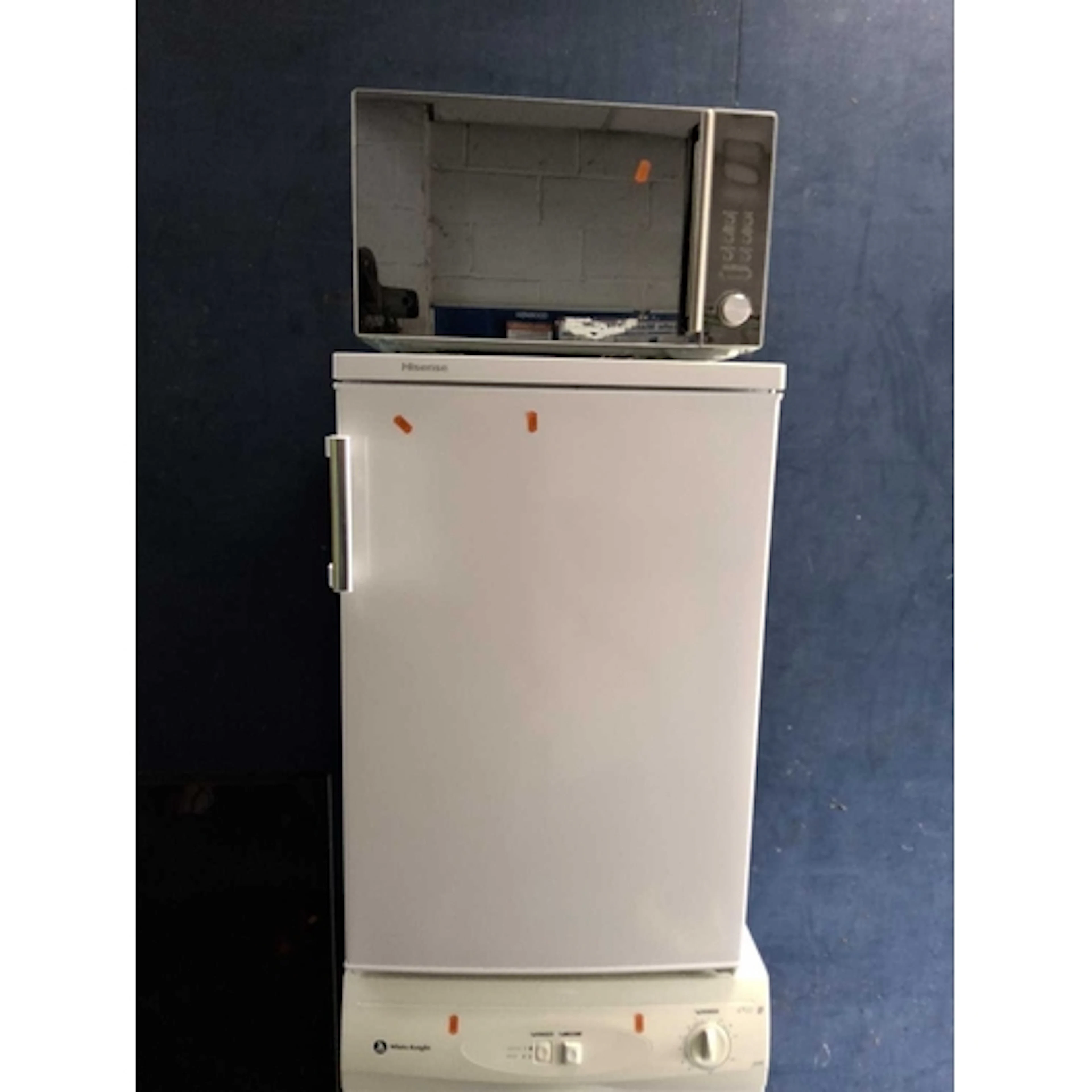 A HISENSE UNDER COUNTER FRIDGE and a Kenwood microwave (both...