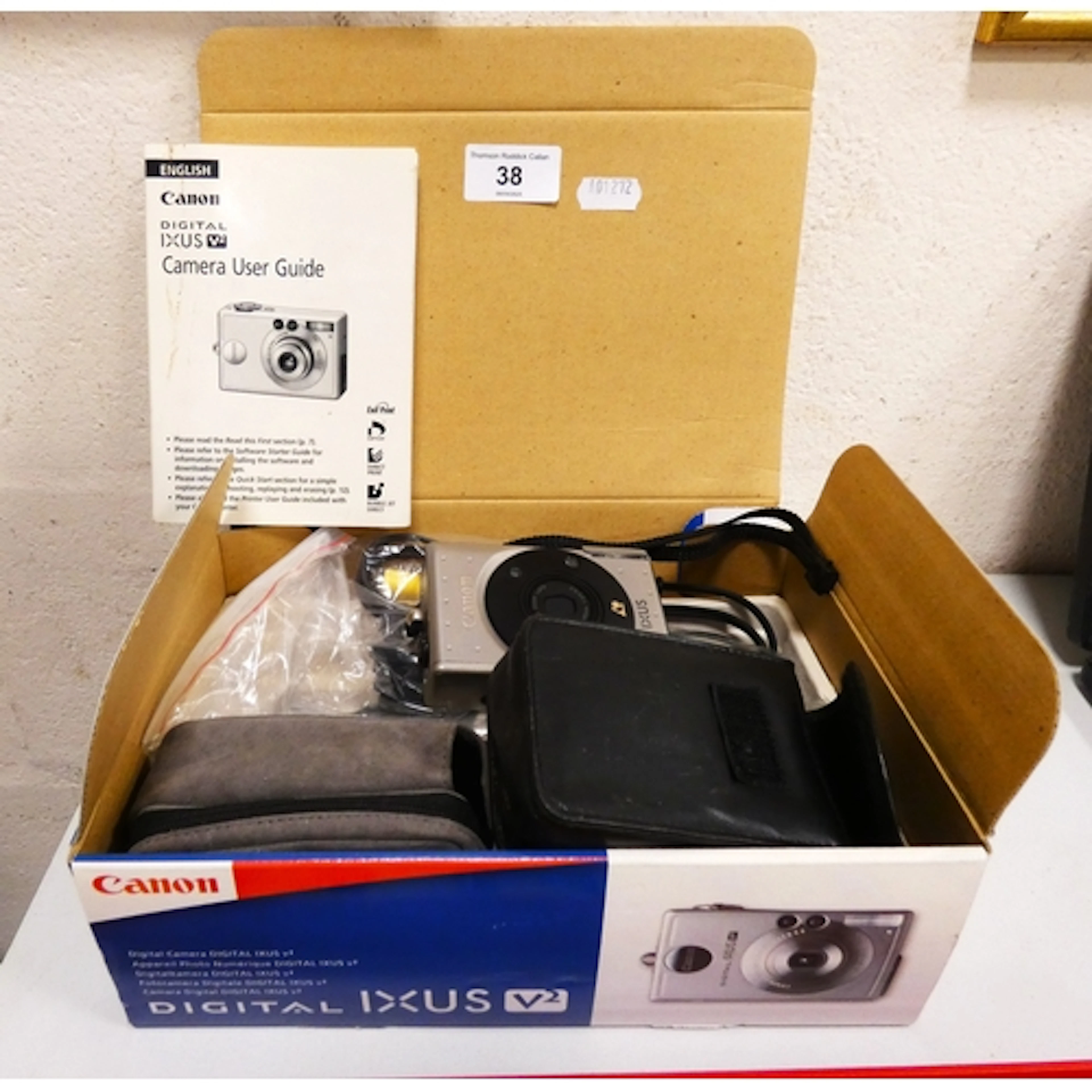Canon IXUS V2 camera with accessories in original box and an...