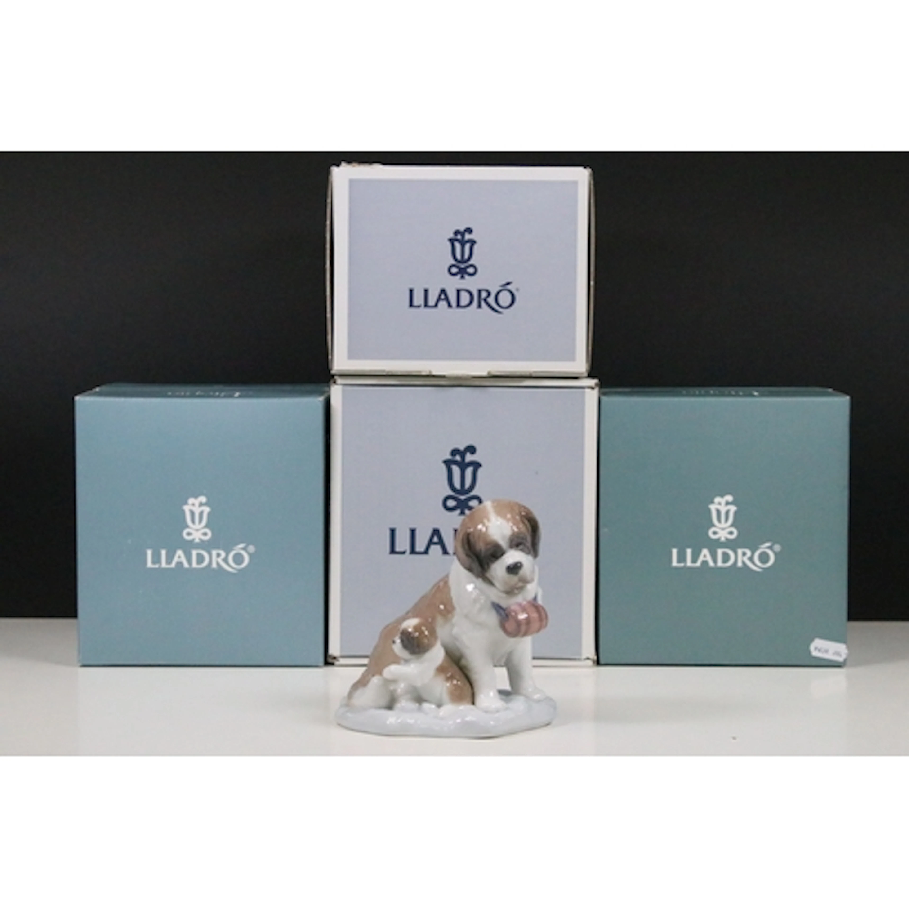 Five Lladro figurines comprising 'Bashful Bather', 'Baby Sit...