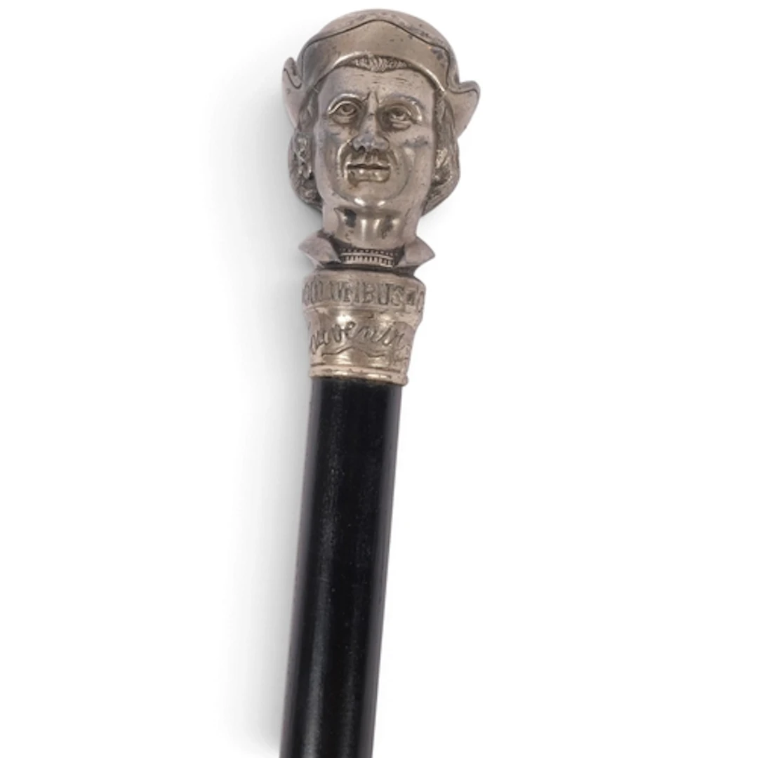 A 19th century walking stick, with white metal handle in the...
