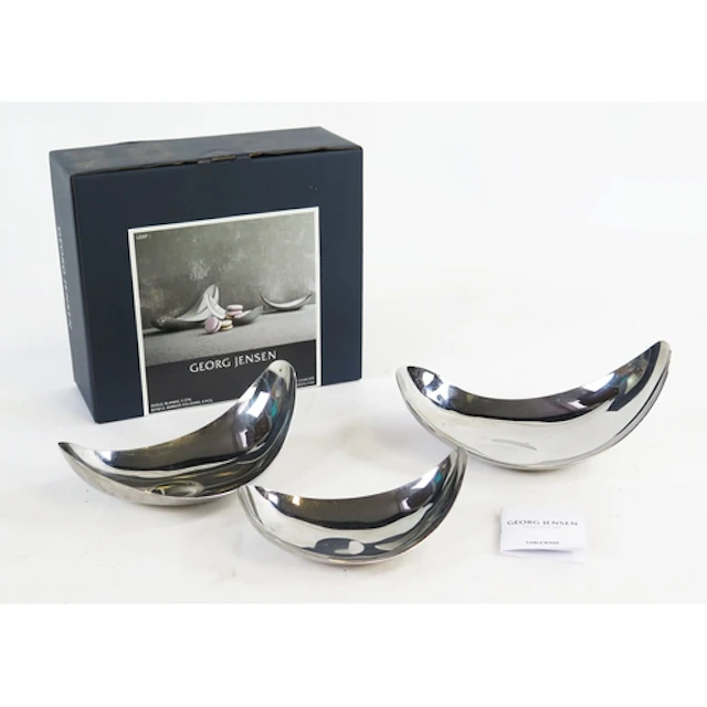 Georg Jensen, three curved polished steel dishes, boxed
