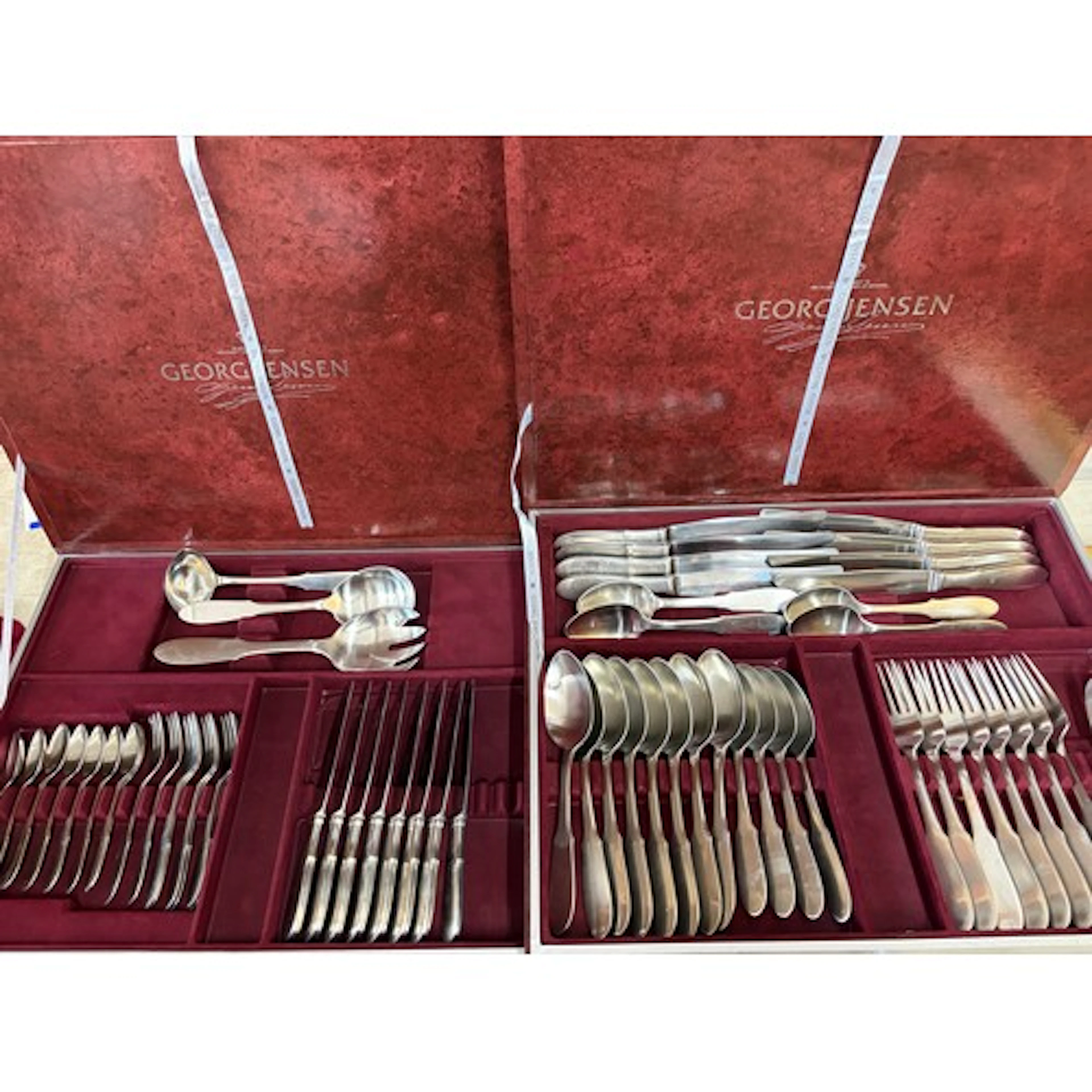 A collection of Georg Jensen stainless steel cutlery, in two...