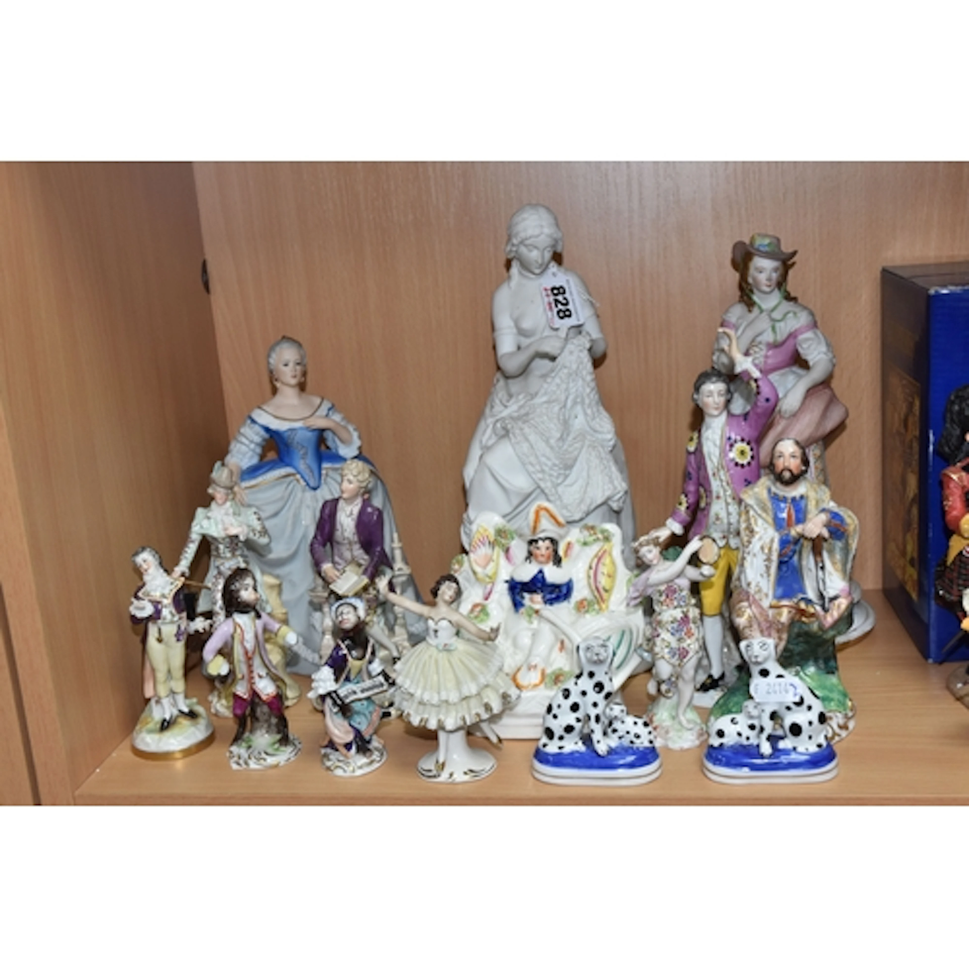 A GROUP OF PORCELAIN FIGURES, to include an unmarked Parian ...