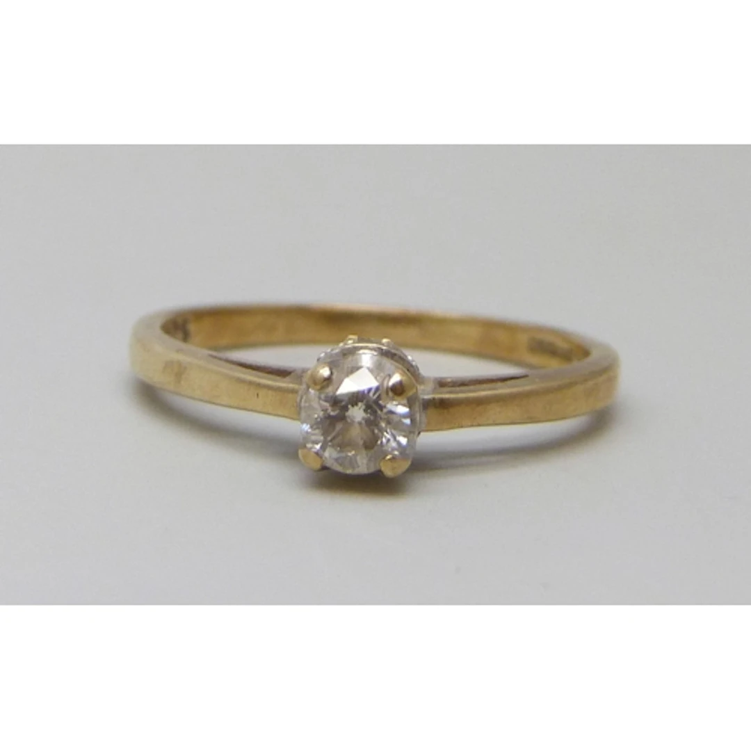 A 9ct gold diamond solitaire ring with diamond setting, 0.25...
