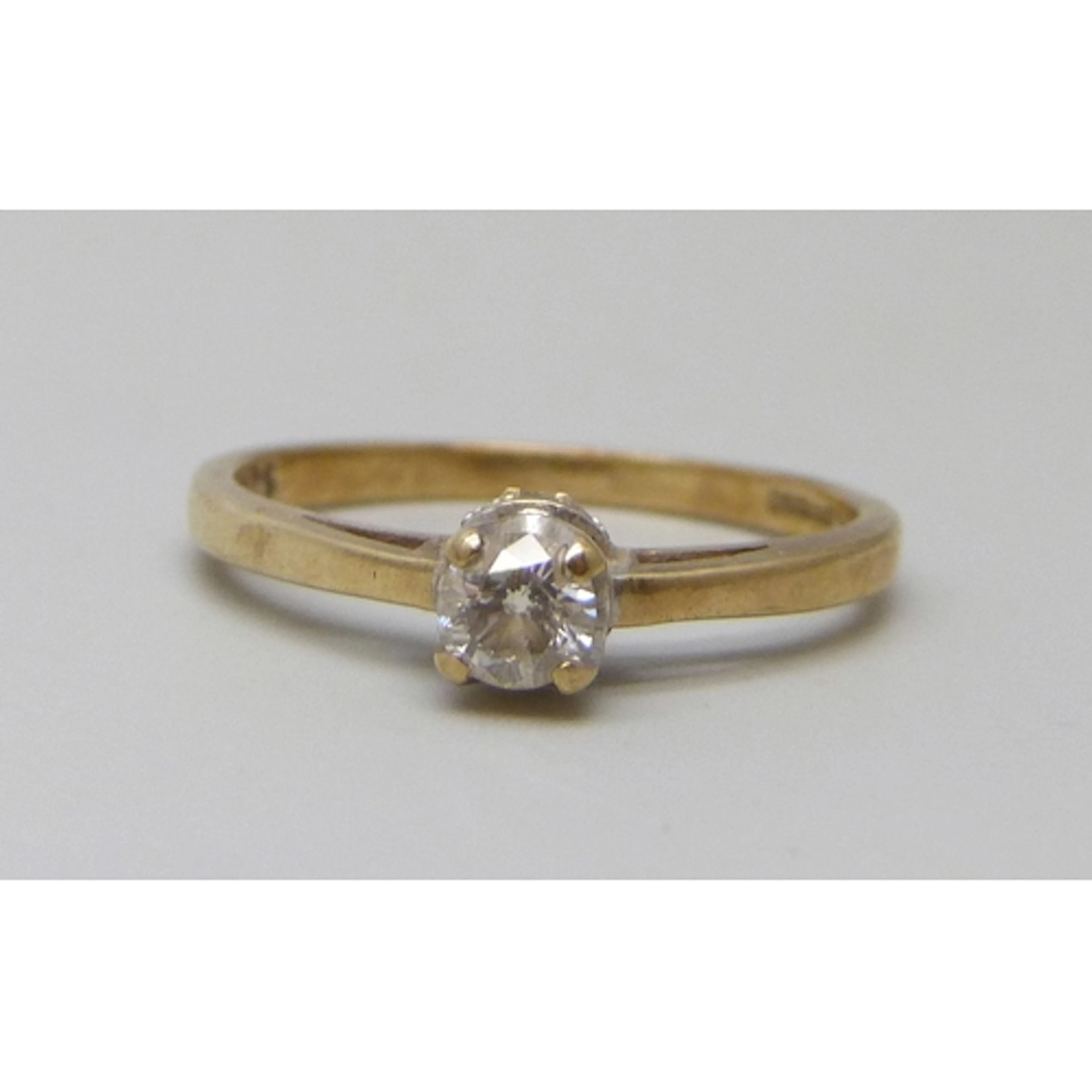 A 9ct gold diamond solitaire ring with diamond setting, 0.25...