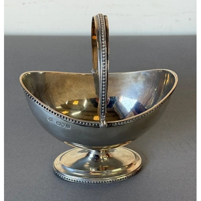 A handled silver hallmarked sugar bowl, approximate weight 1...