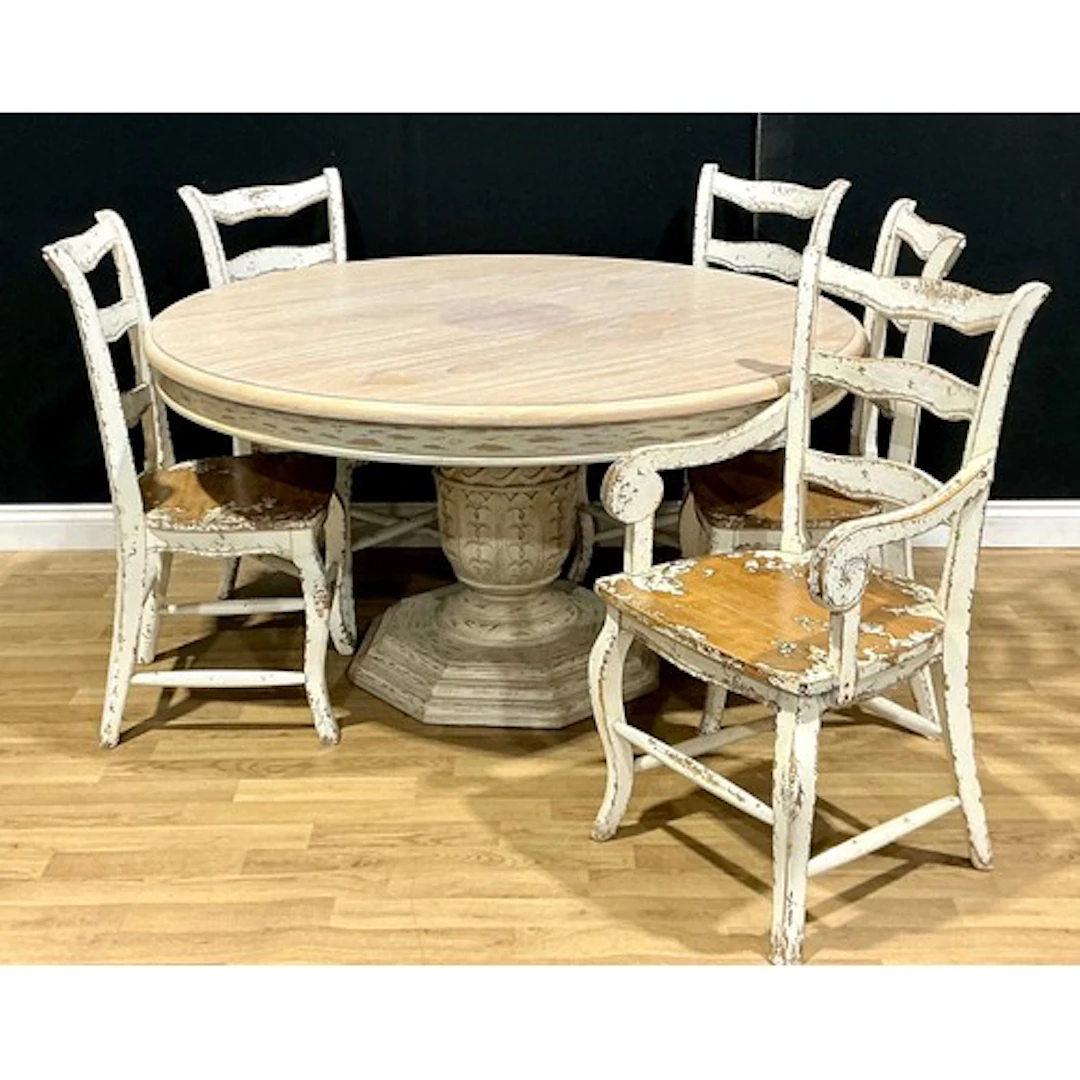 A contemporary limed effect circular pedestal dining table, ...