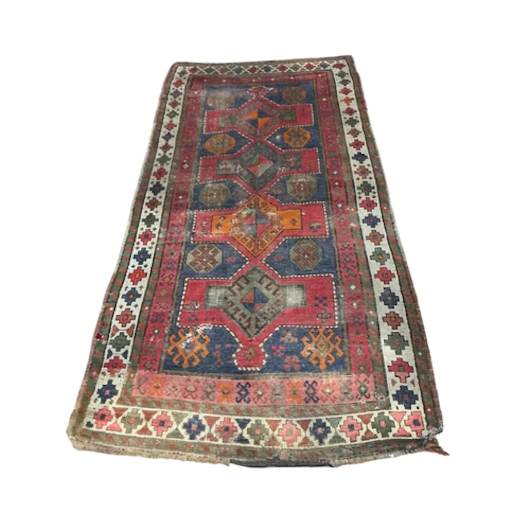 An antique Turkish blue ground rug, 221 x 110cm