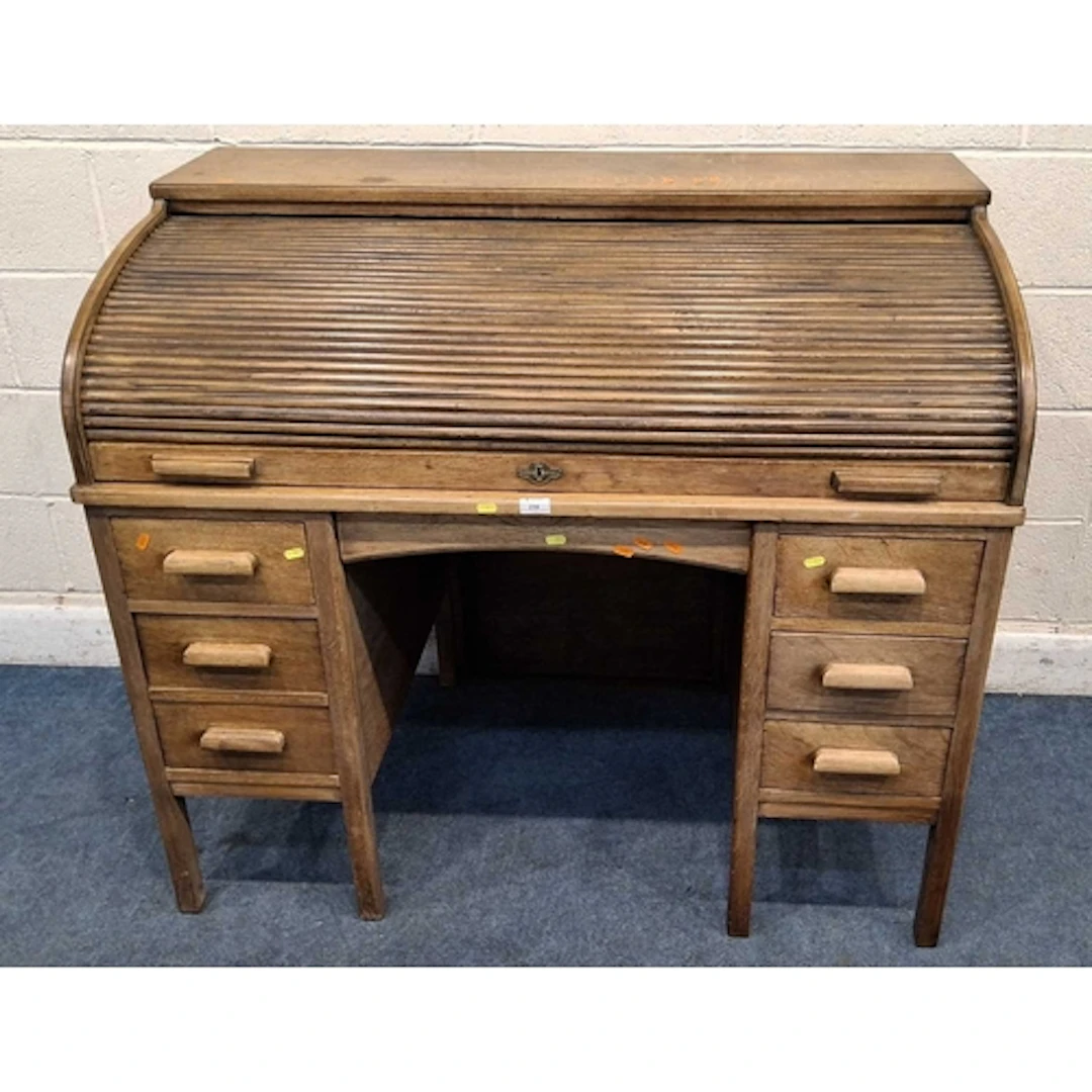 A LEBUS EARLY 20TH CENTURY OAK ROLL TOP DESK, the tambour do...