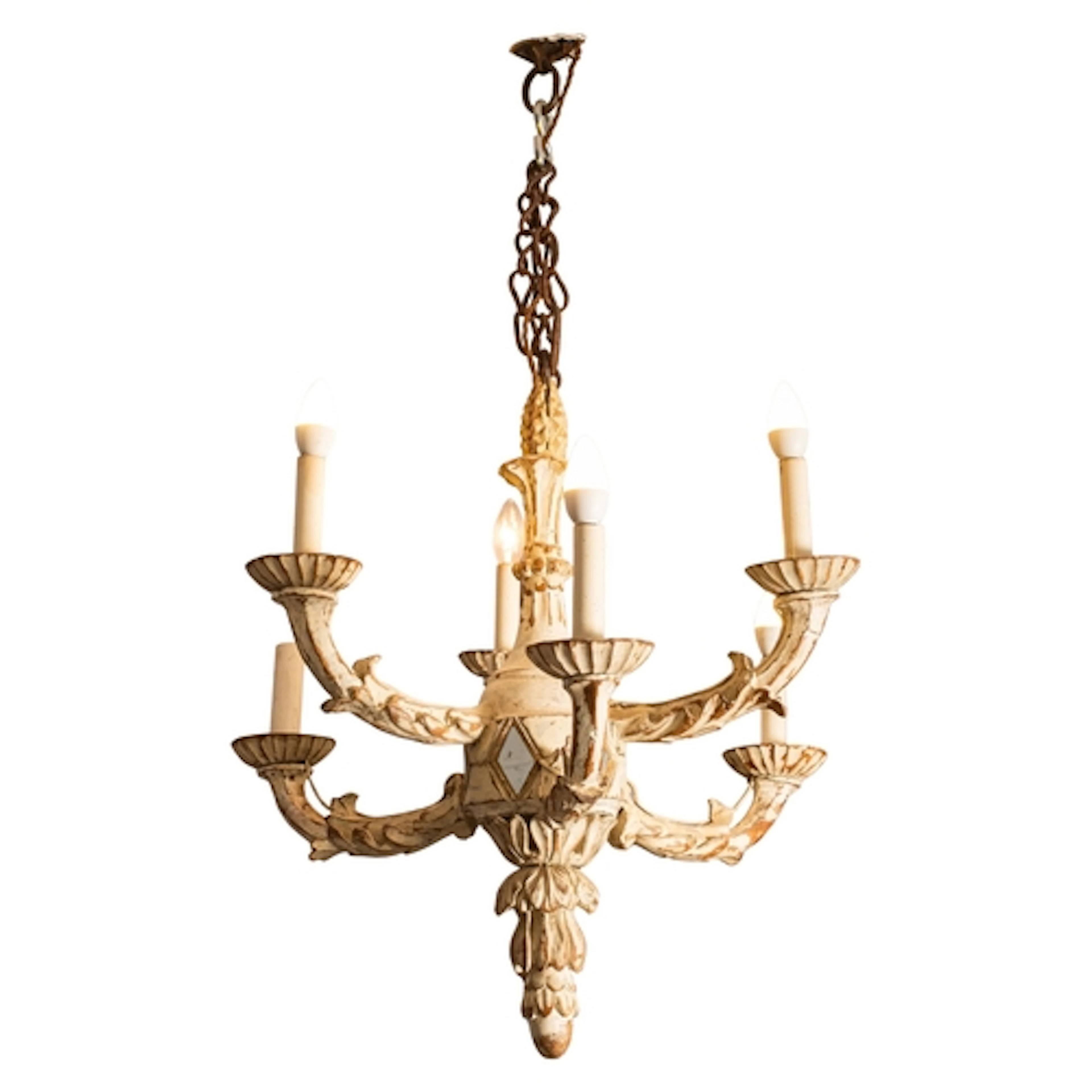 A carved and cream painted wood six light chandelier, 20th c...