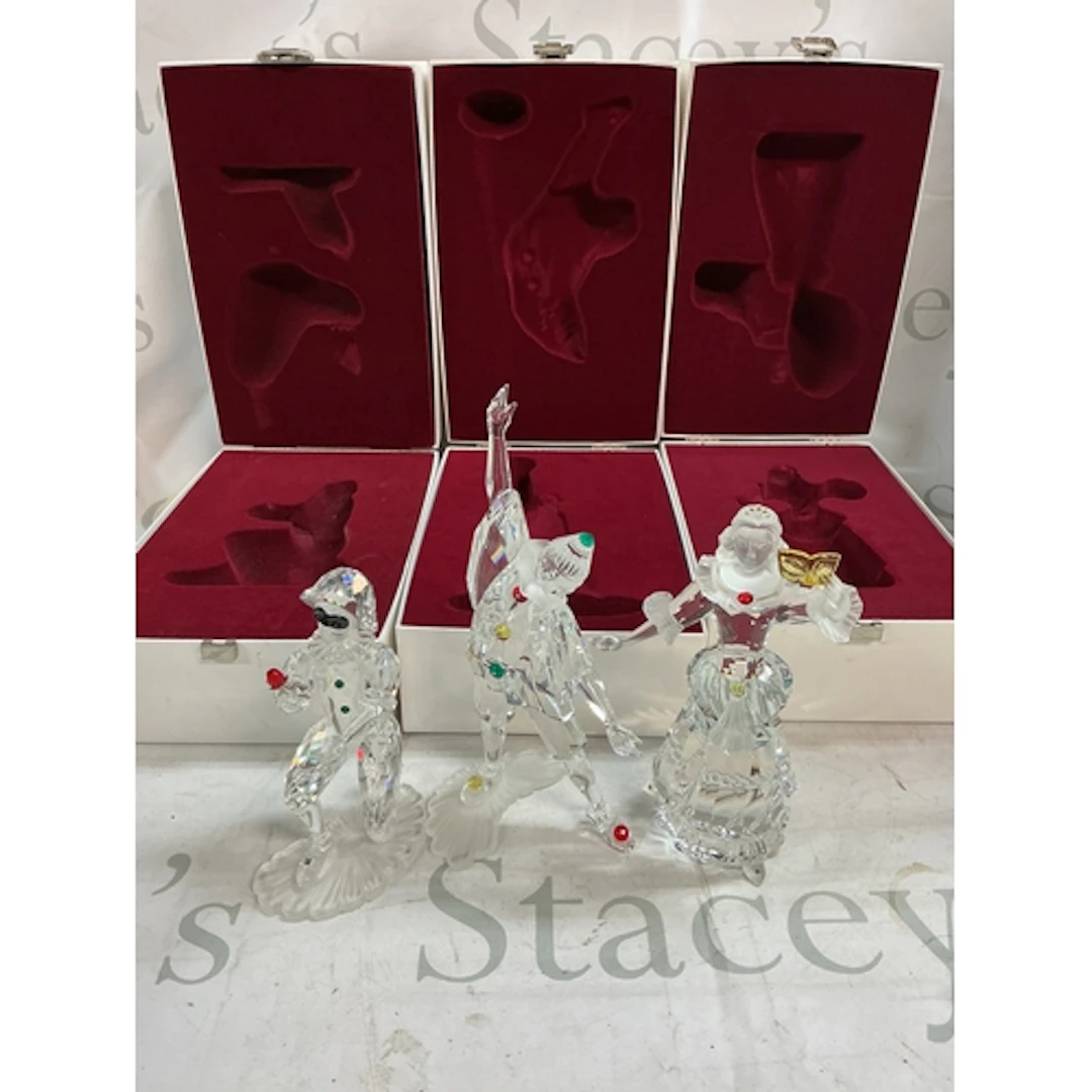 Three boxed ‘Masquerade’ Swarovski figures