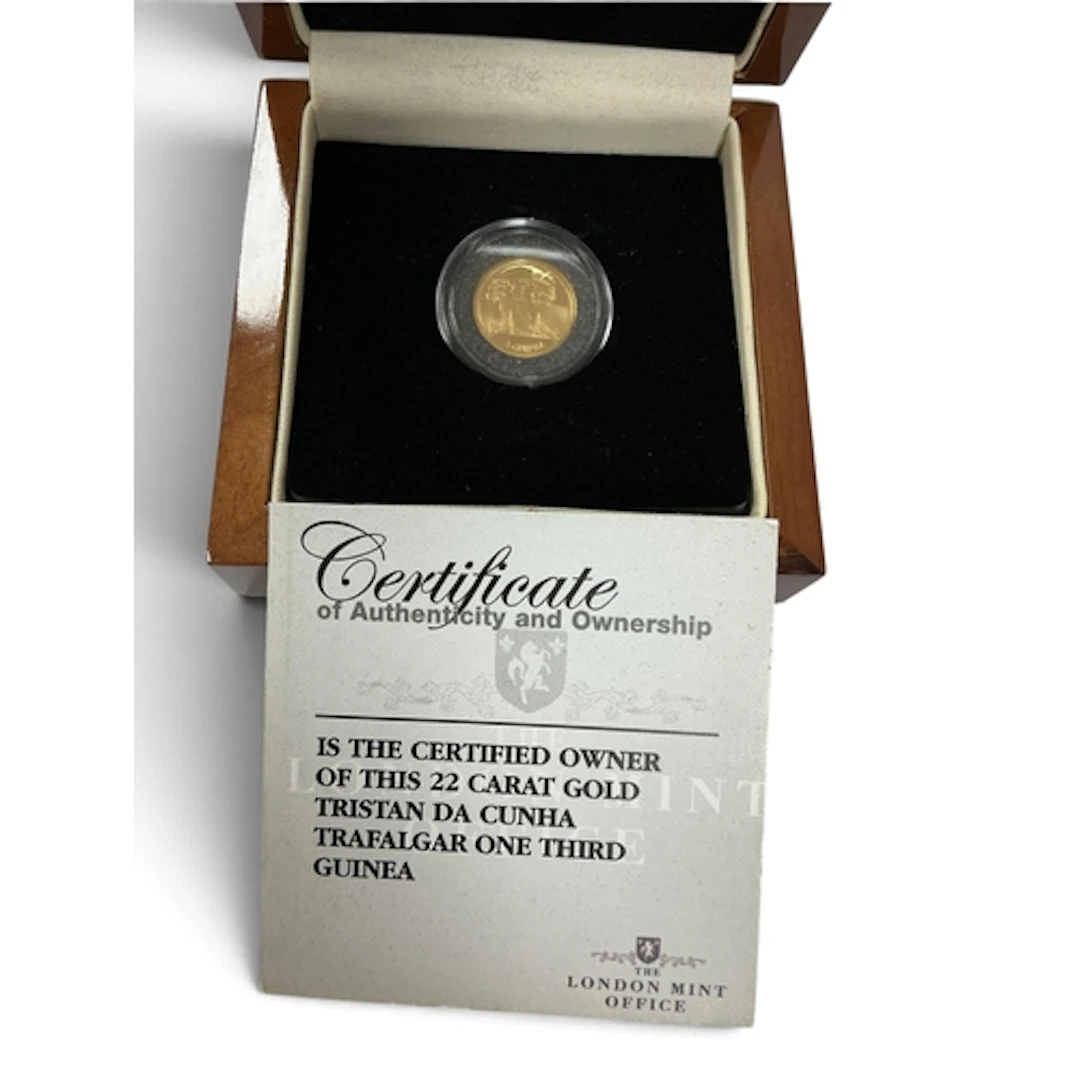 2008 Tristan Da Cunha Gold 1/3 Guinea Coin, together with a ...