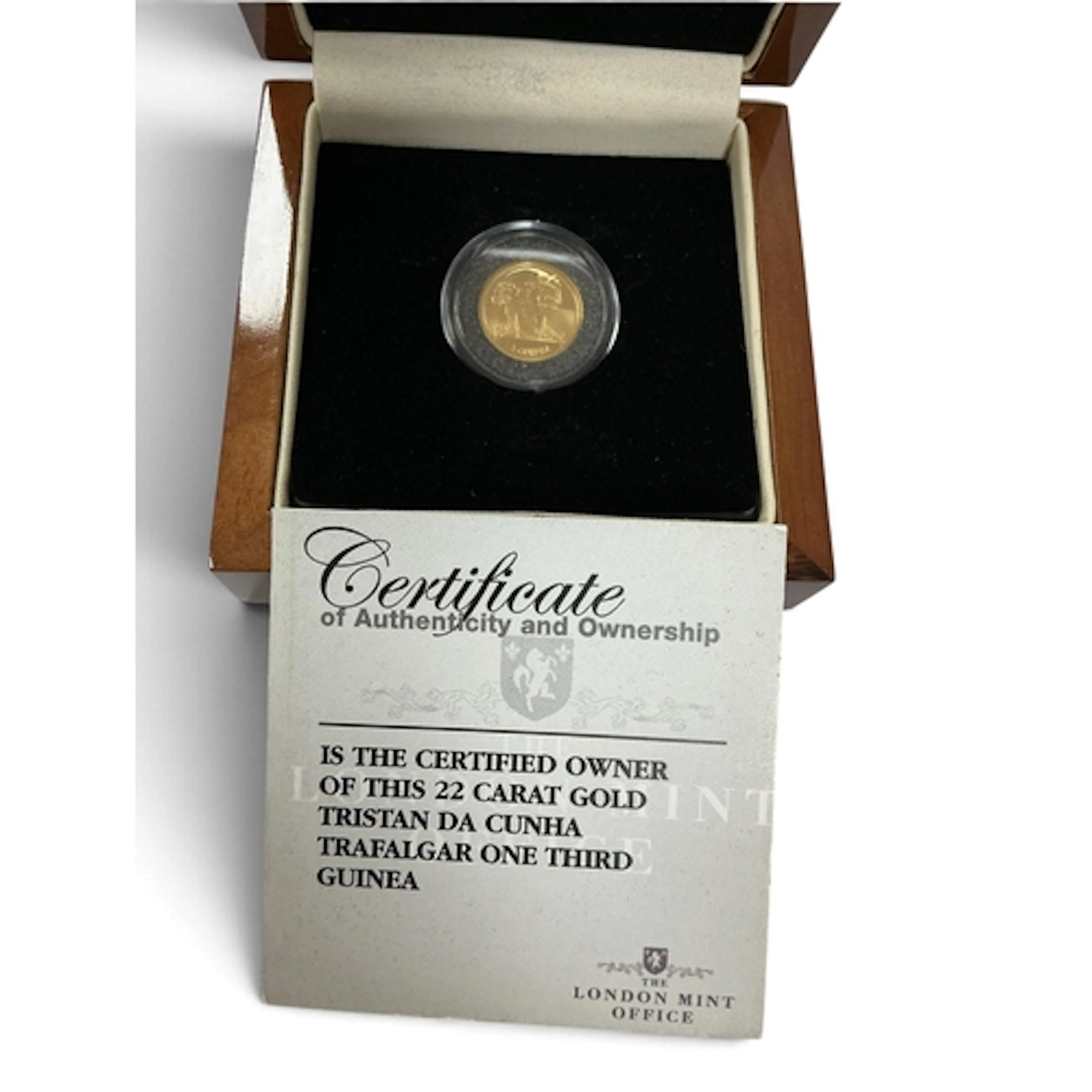 2008 Tristan Da Cunha Gold 1/3 Guinea Coin, together with a ...